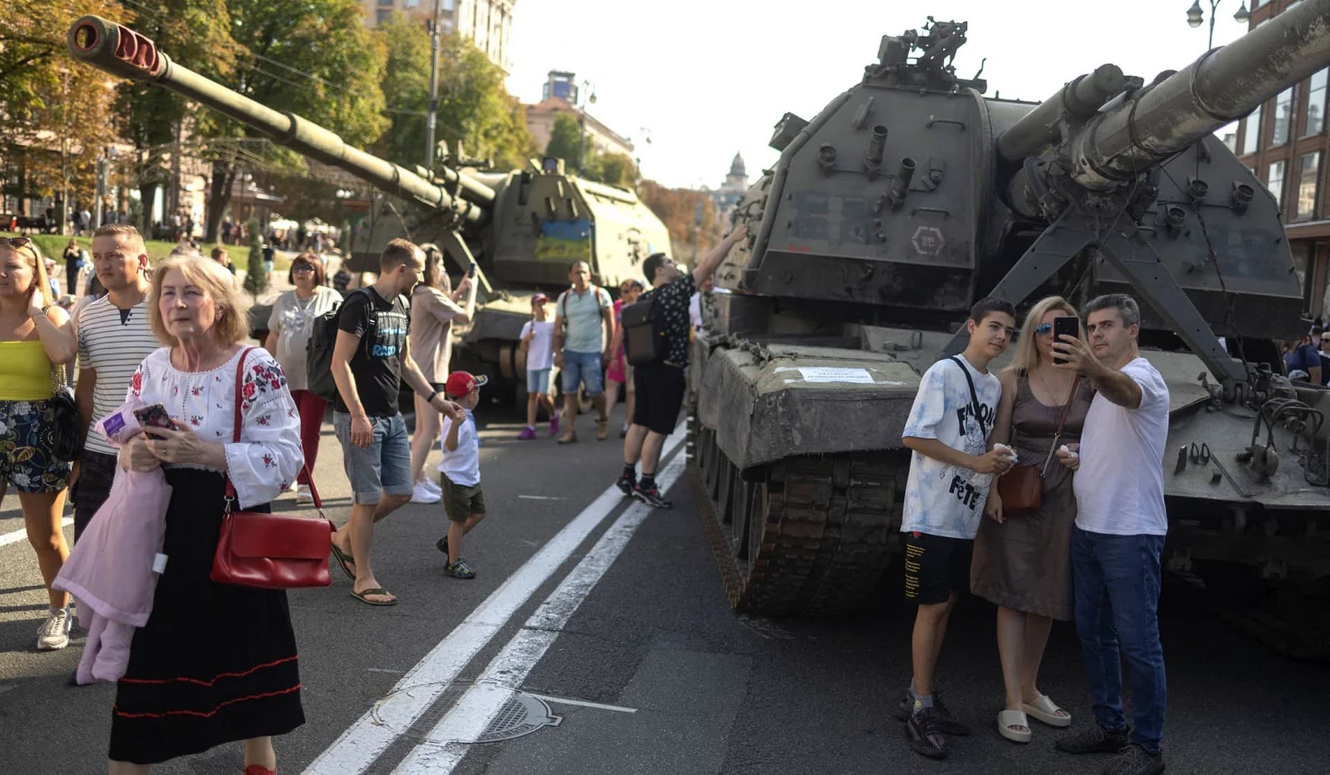 People visit an exhibition of destroyed Russian military vehicles and weapons in Kyiv