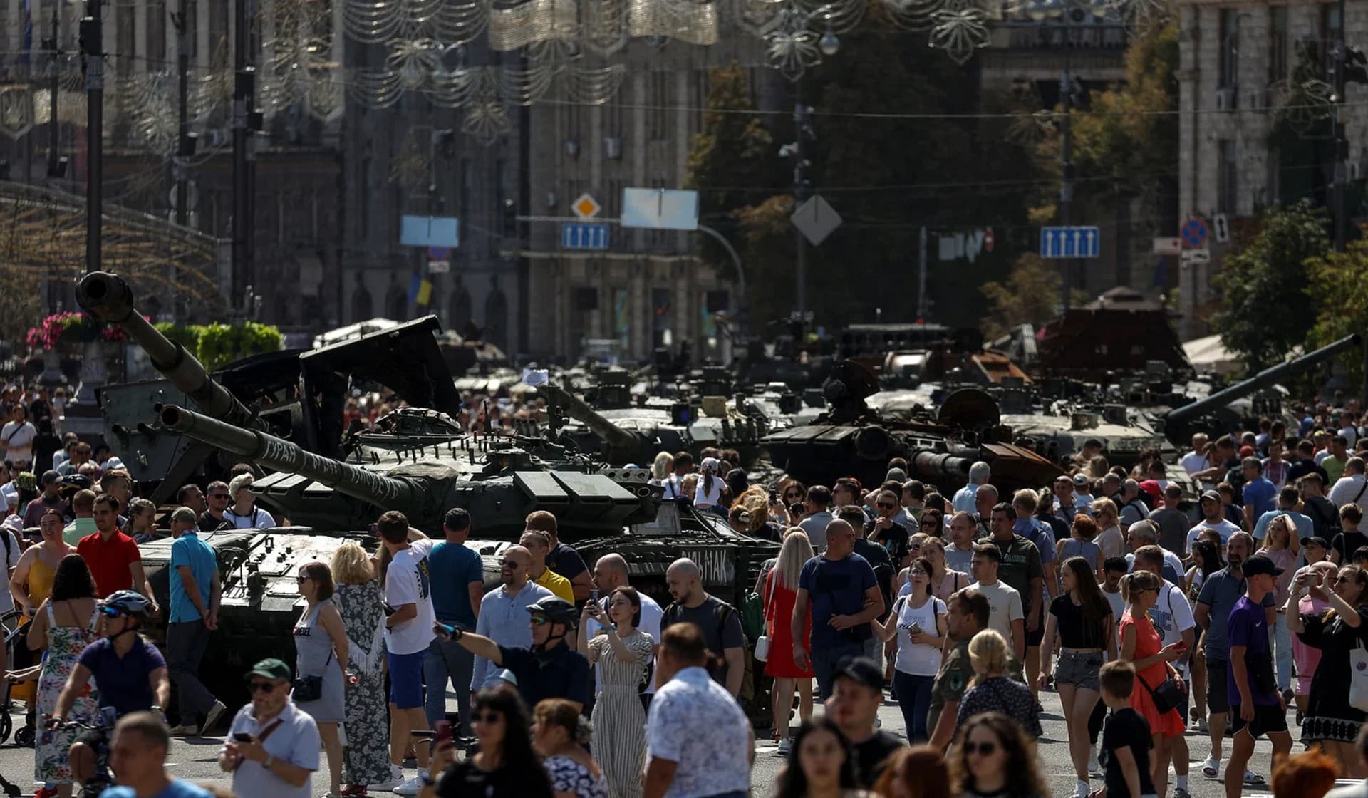 People visit an exhibition of destroyed Russian military vehicles and weapons in Kyiv