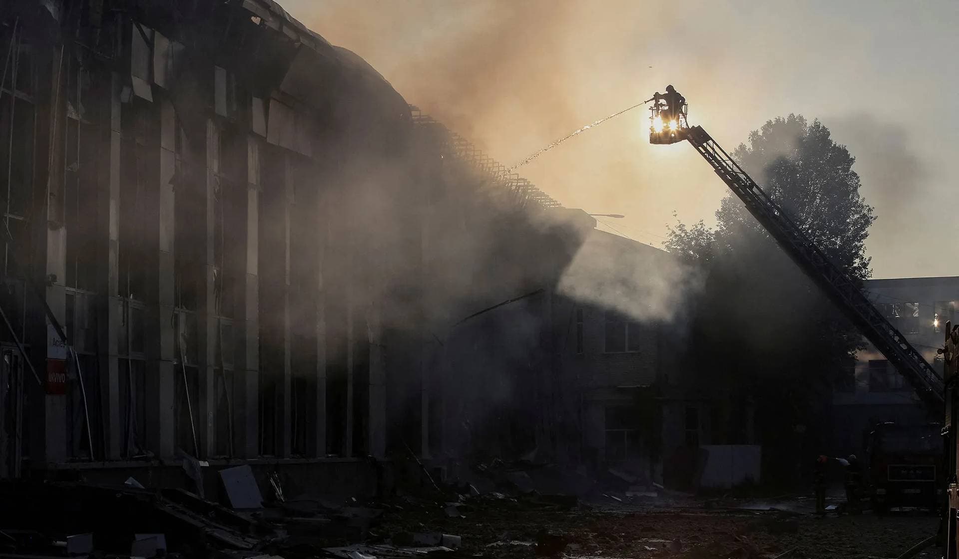 Rescuers work at the site of the Russian drone and missile strike in Kyiv