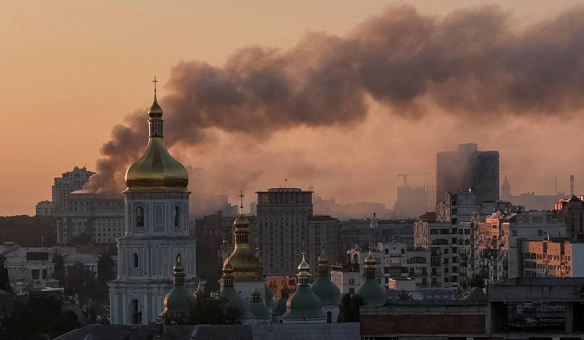 Smoke rises over a building of the Ukrainian government headquarters, after Russian drone and missile strikes in Kyiv