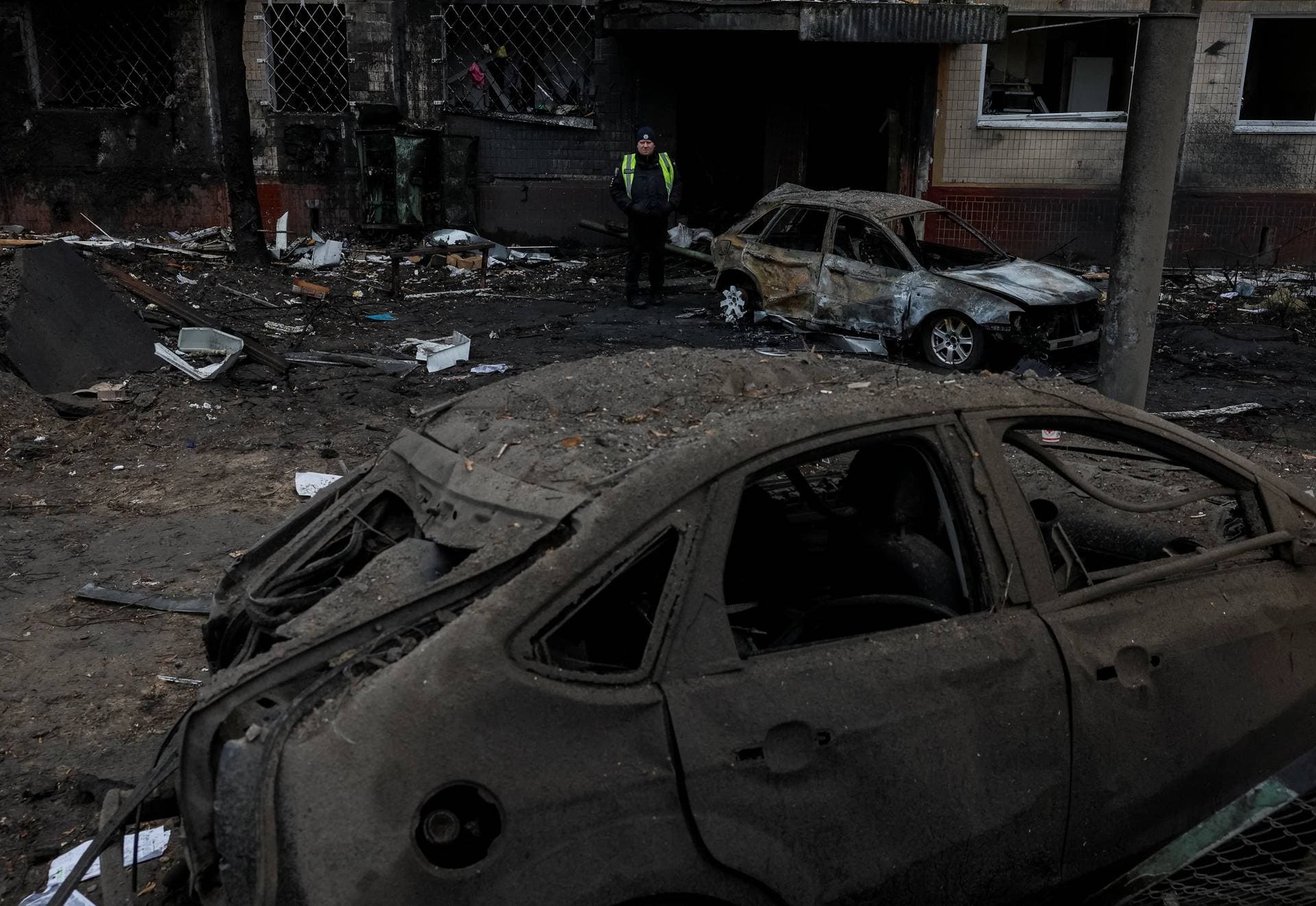 A view shows the site where an apartment building damaged during a Russian missile strike in Kyiv