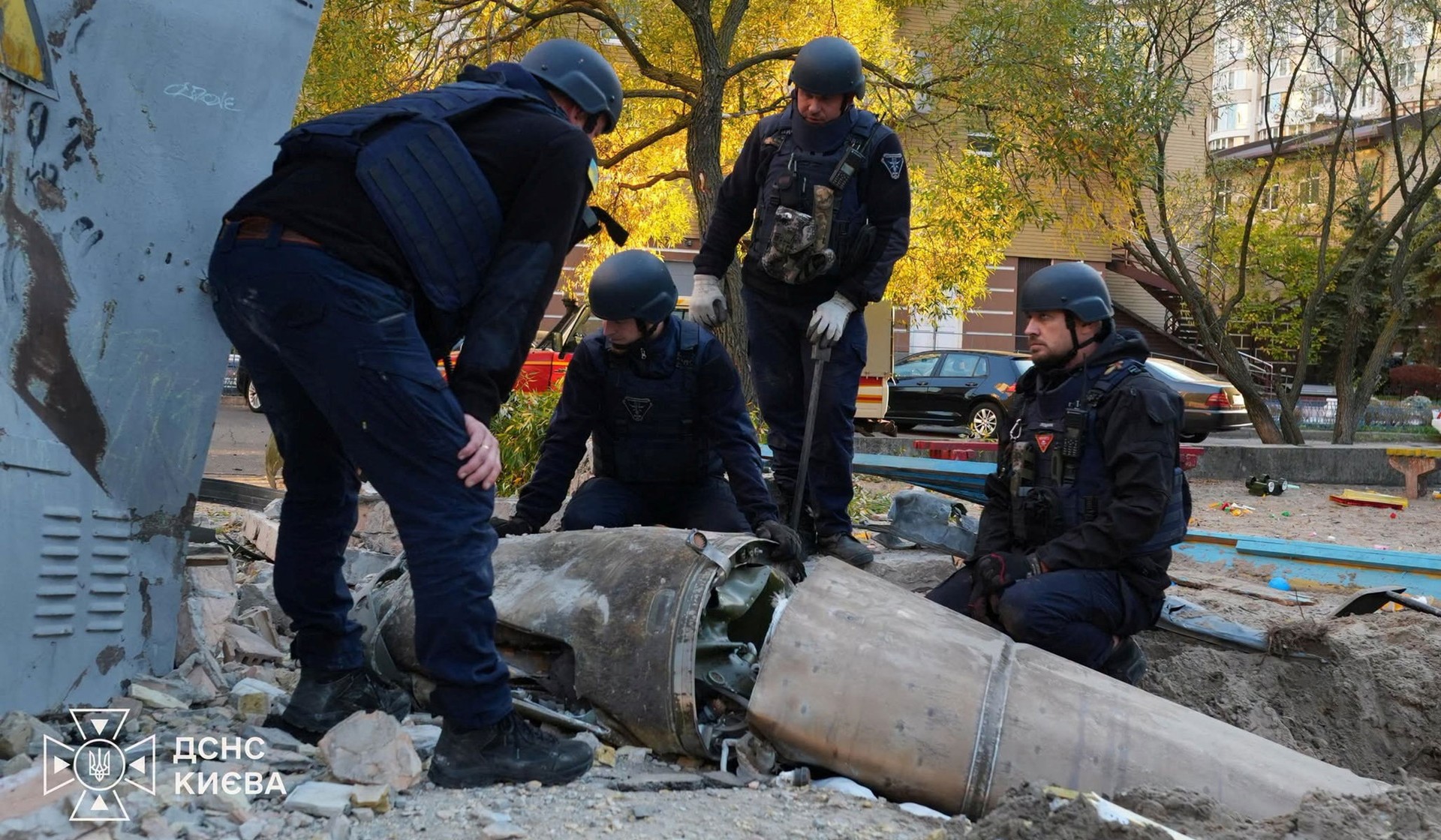 State Emergency Service deminers work to deactivate an unexploded warhead of a Russian ballistic missile which fell down after an interception in a residential area amid Russia's attack, in Kyiv