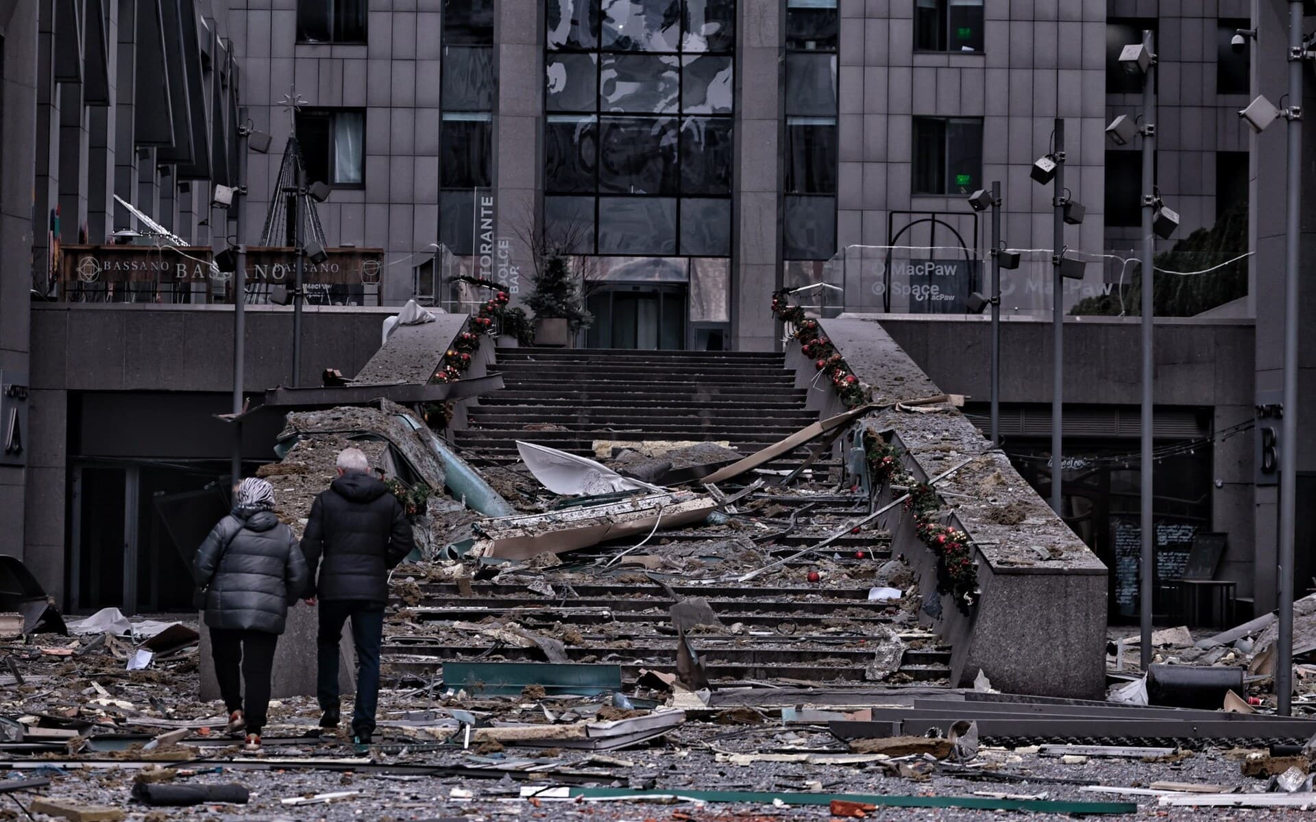 People look at the 'Toronto' business centre building that was damaged in the attack in Kyiv