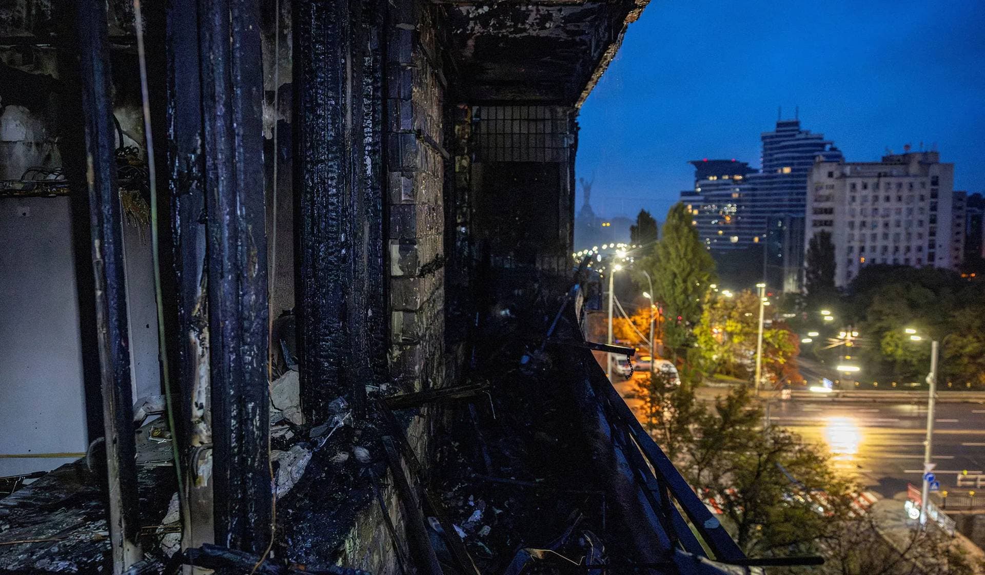 The charred balcony of an apartment in a building that was set ablaze during Russian drone and missile strikes on the capital in Kyiv
