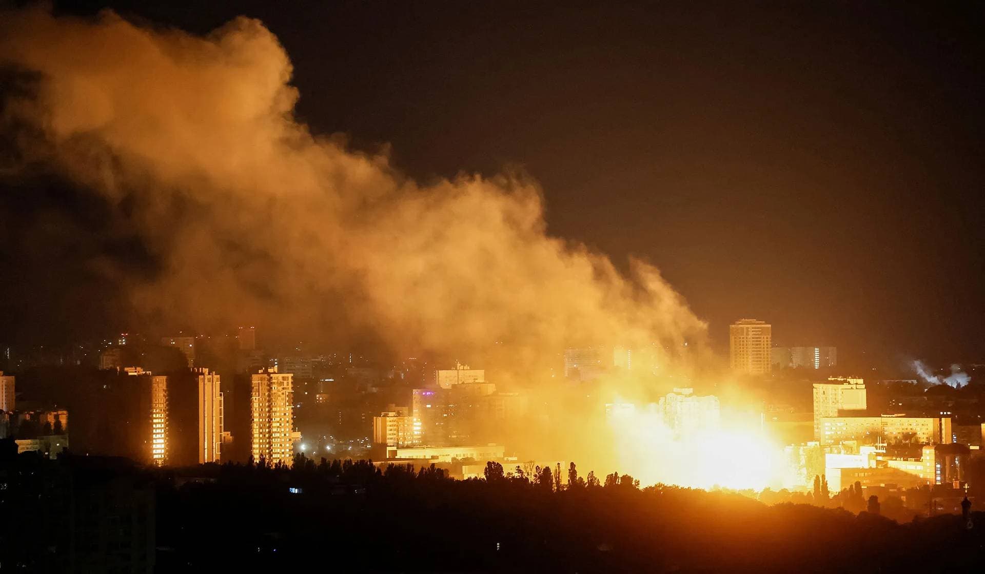 An explosion of a drone lights up the sky over the city during a Russian drone and missile strike in Kyiv