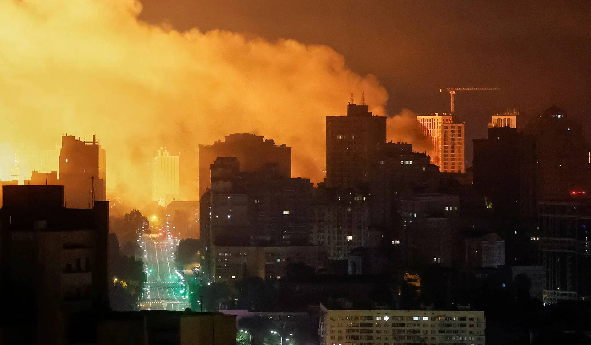 An explosion of a drone lights up the sky over the city during a Russian drone and missile strike in Kyiv