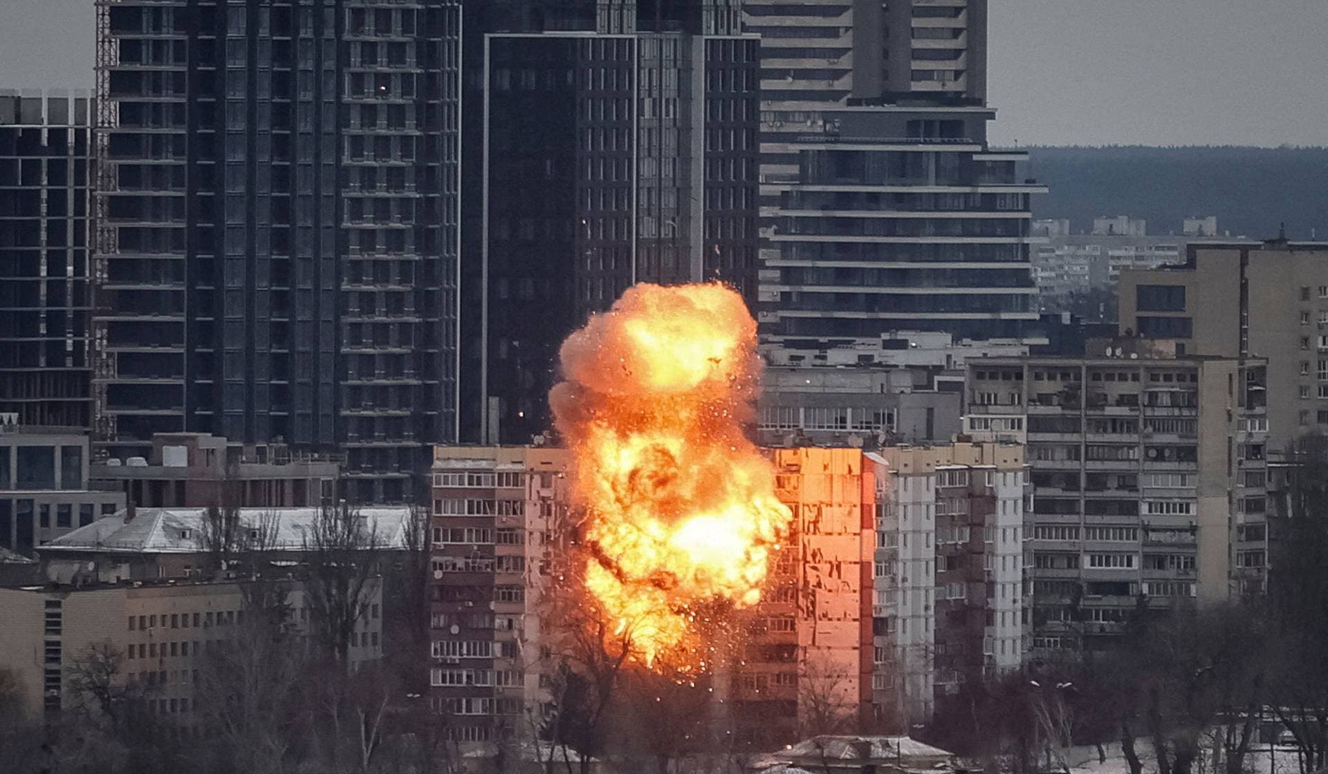 A drone hits an apartment building during a Russian missile and drone strike in Kyiv