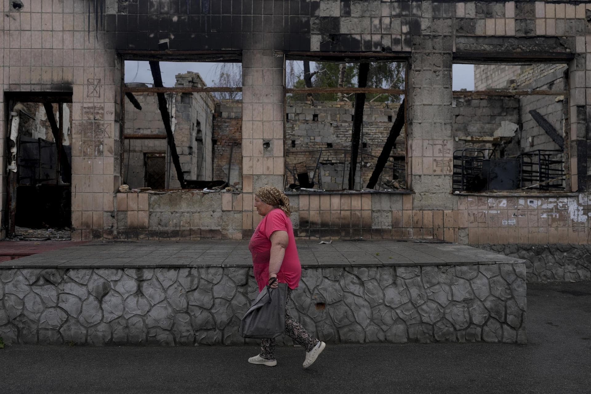 A woman heads to the market in Makariv, on the outskirts of Kyiv