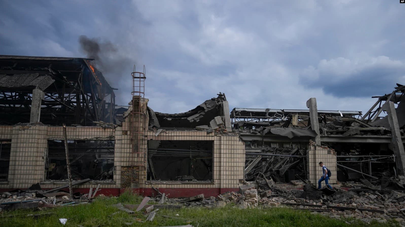 Smokes raises from a railway service facility hit by a Russian missile strike in Kyiv