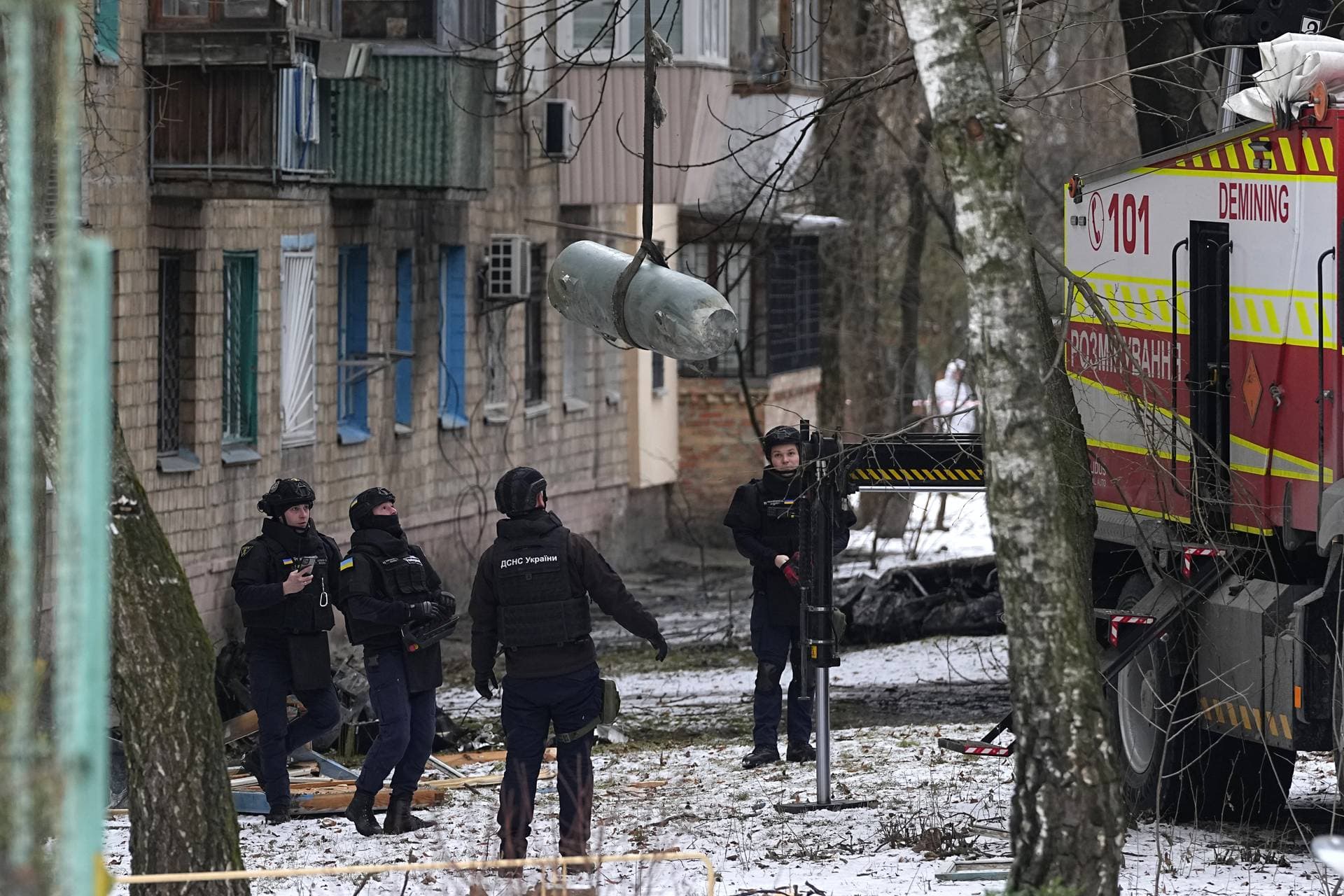 Sappers load an unexploded missile warhead onto a truck after the Russian aerial attack on Kyiv