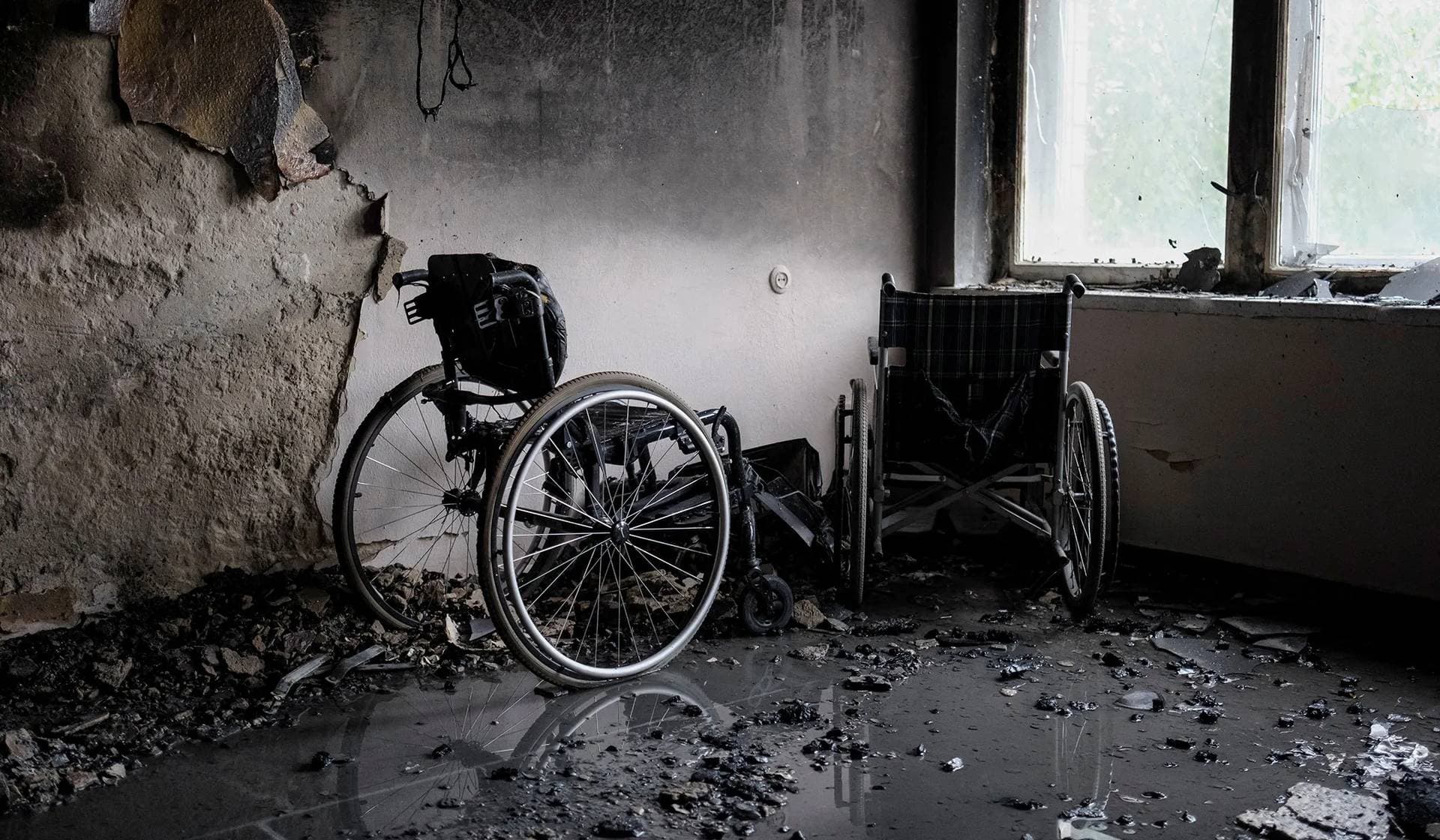 Wheelchairs stand in the burned corridor of a cardiology clinic hit during Russian drone and missile strikes in Kyiv