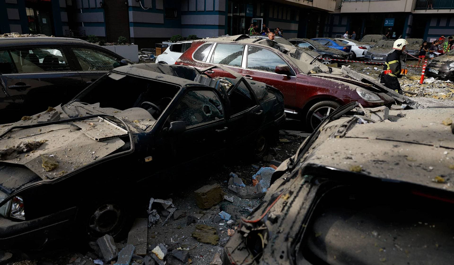 Rescuers work at the site of an apartment building damaged during Russian missile strikes in Kyiv