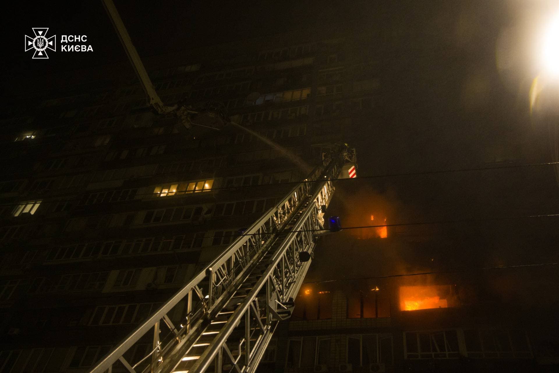 Firefighters work at a residential neighbourhood in Kyiv