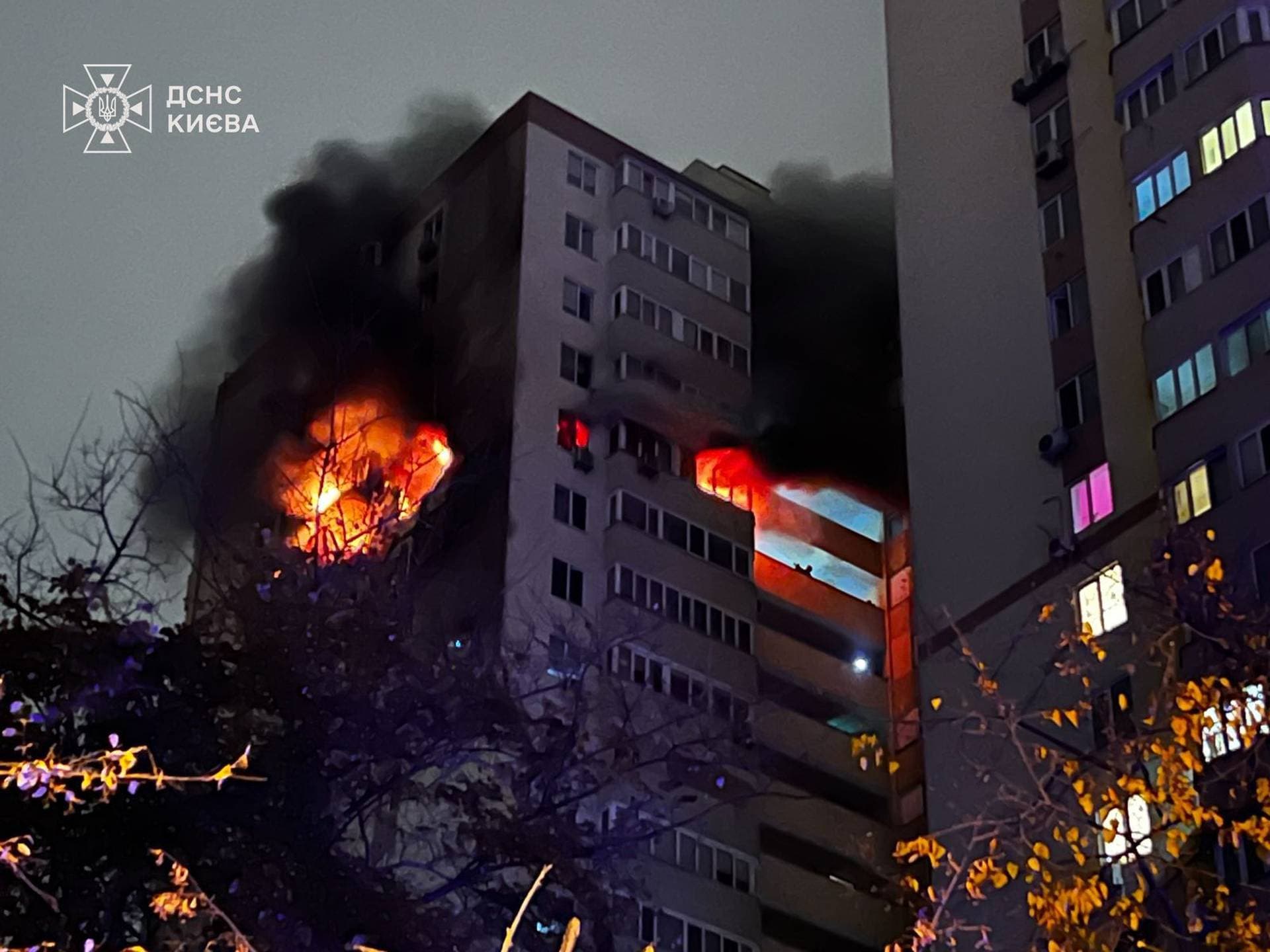 Flames and smoke rise from an apartment building damaged during a Russian drone strike in Kyiv