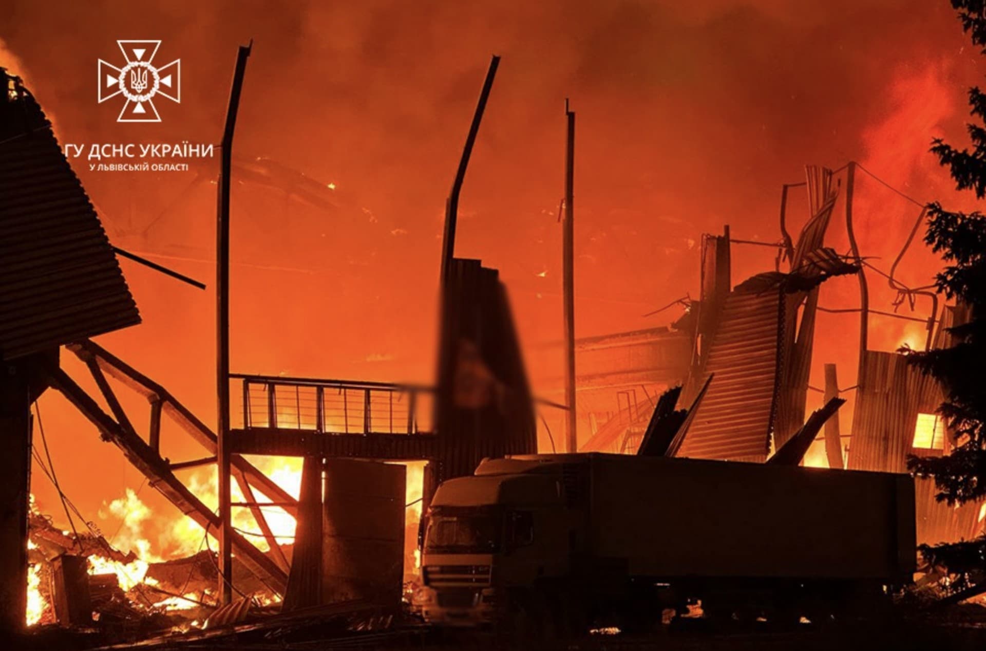 a burning industrial warehouse, damaged by a Russian drone strike, in Lviv