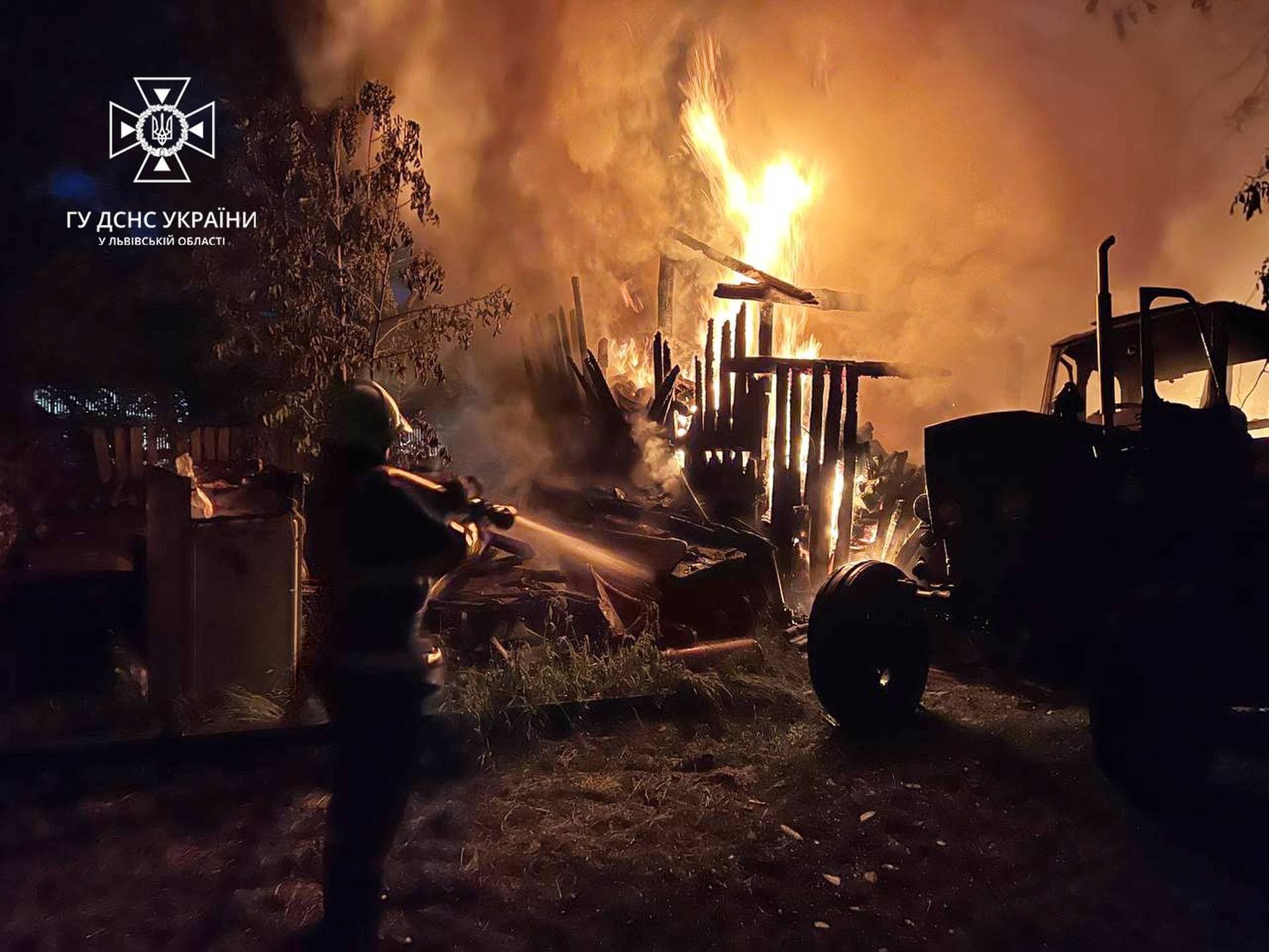 A firefighter works at a compound of a private house damaged during a massive Russian air strike in Lviv Region