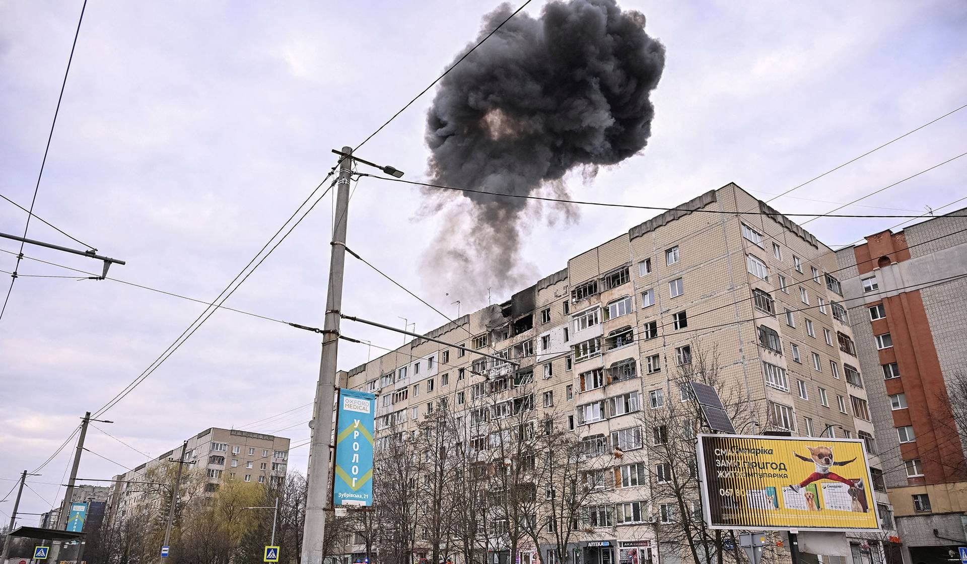 Smoke rises as a Russian drone hits an apartment building in Lviv