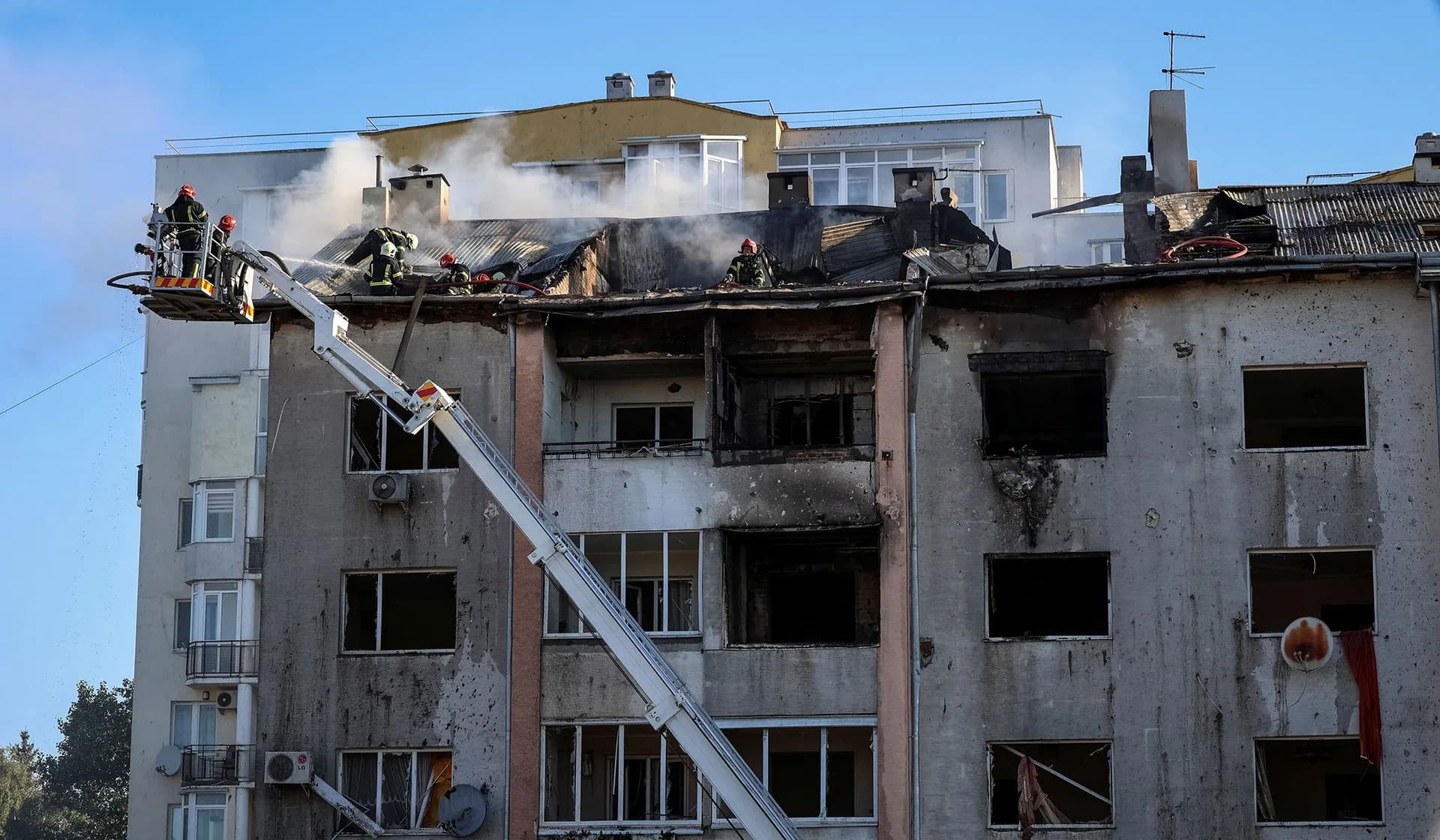 Rescuers work at a site of a residential building destroyed during a Russian military strike in Lviv