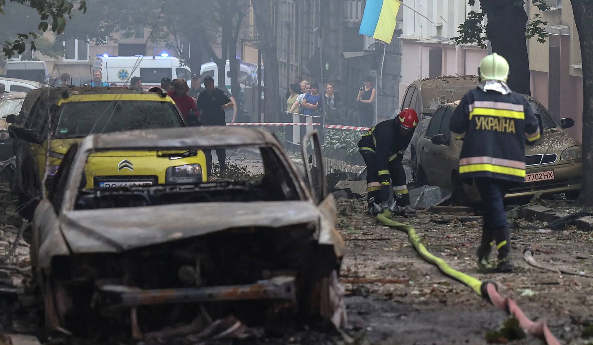 Rescuers work at the site of a residential building damaged during a Russian drone and missile strike in Lviv