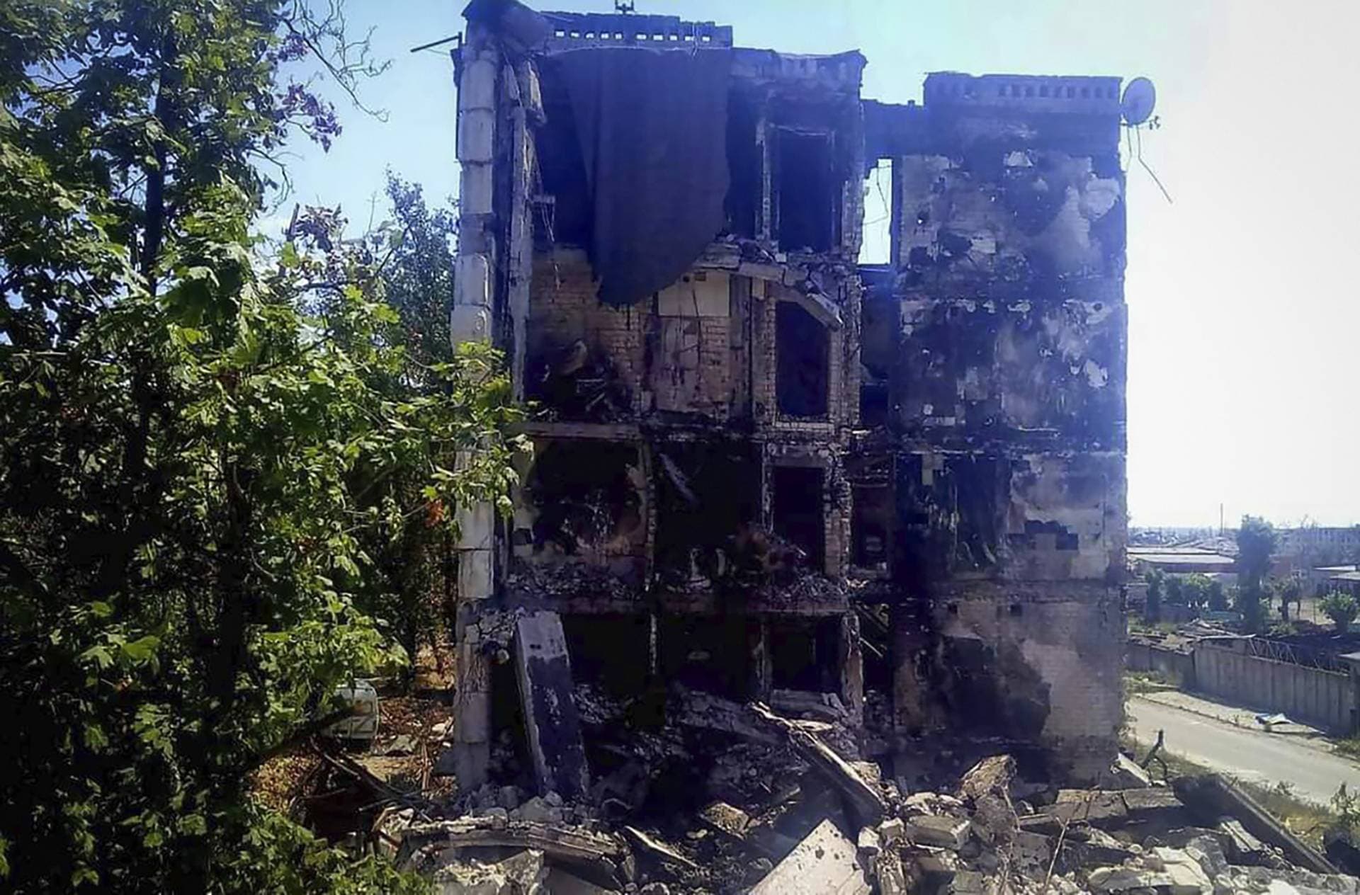 damaged residential buildings are seen in Lysychansk