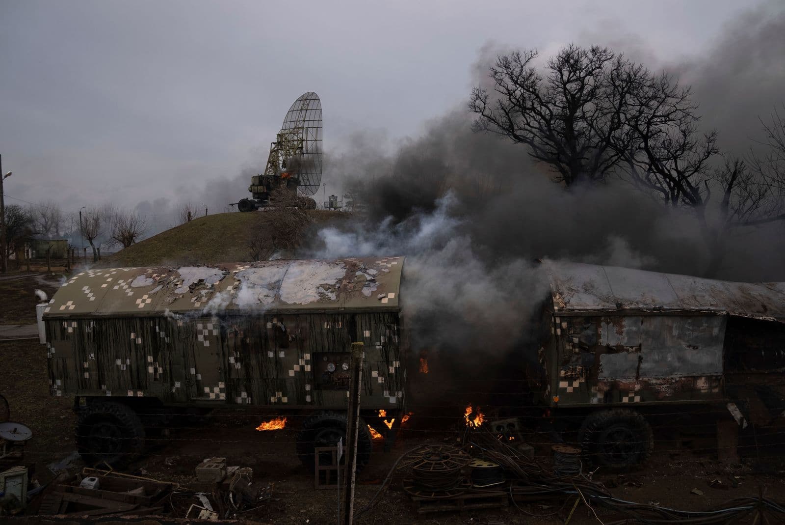 Smoke rises from an air defense base after an apparent Russian strike in Mariupol on February 24