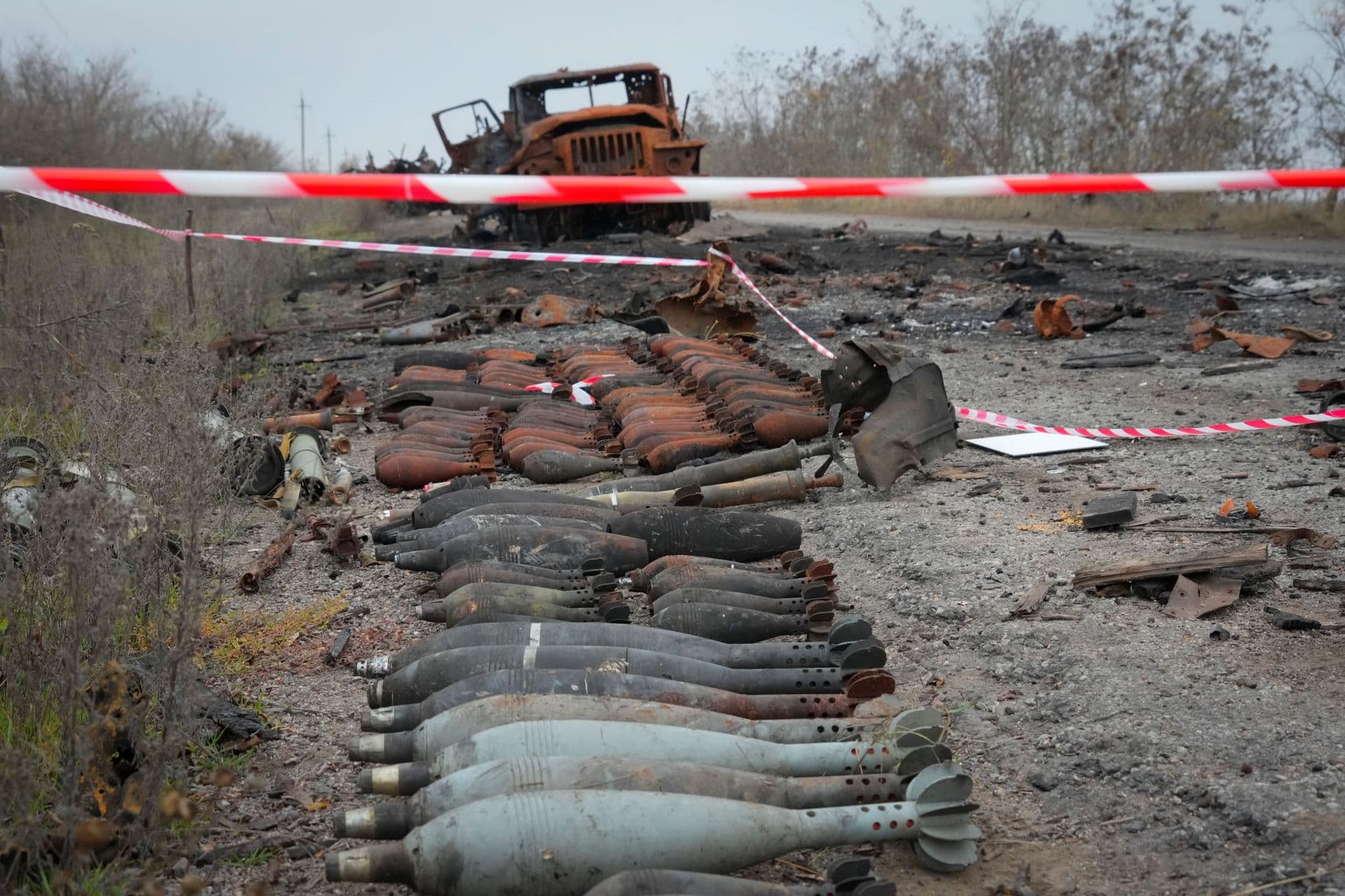 A burnt military car lies by the road after heavy battles between Ukrainian troops and Russian invaders in Mykolayiv region