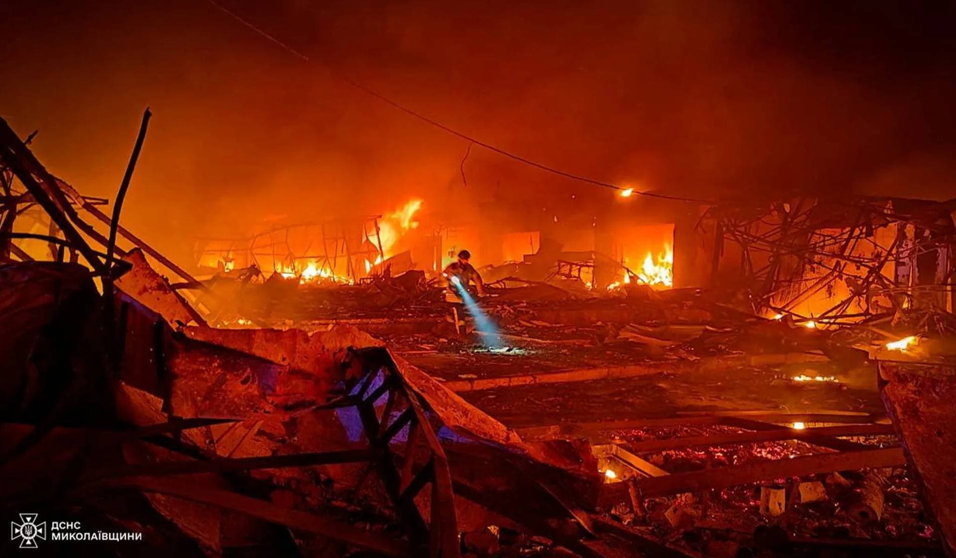 A rescuer works at the site of a Russian missile strike in Mykolaiv
