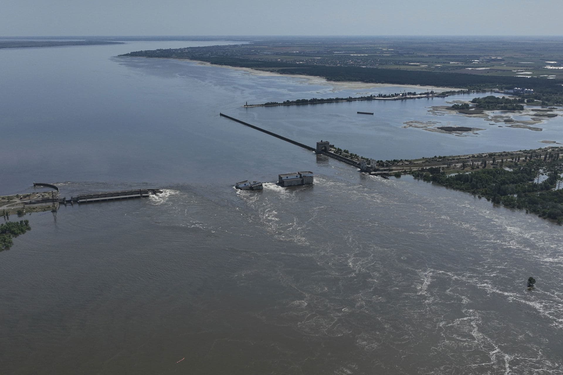 Water flows over the collapsed Kakhovka Dam in Nova Kakhovka