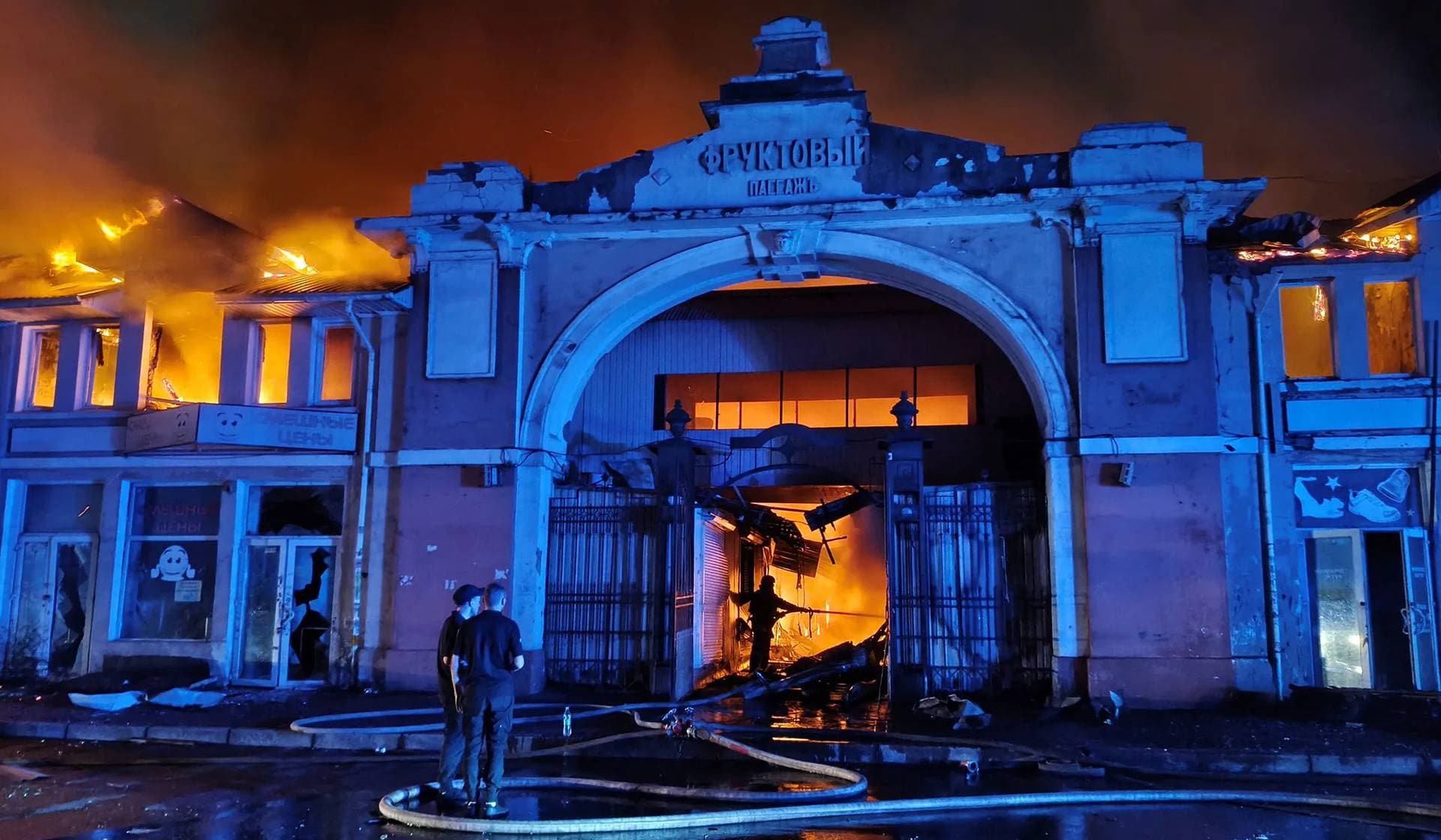 A firefighter works at the site of the Pryvoz market hit by Russian drone strike in Odesa