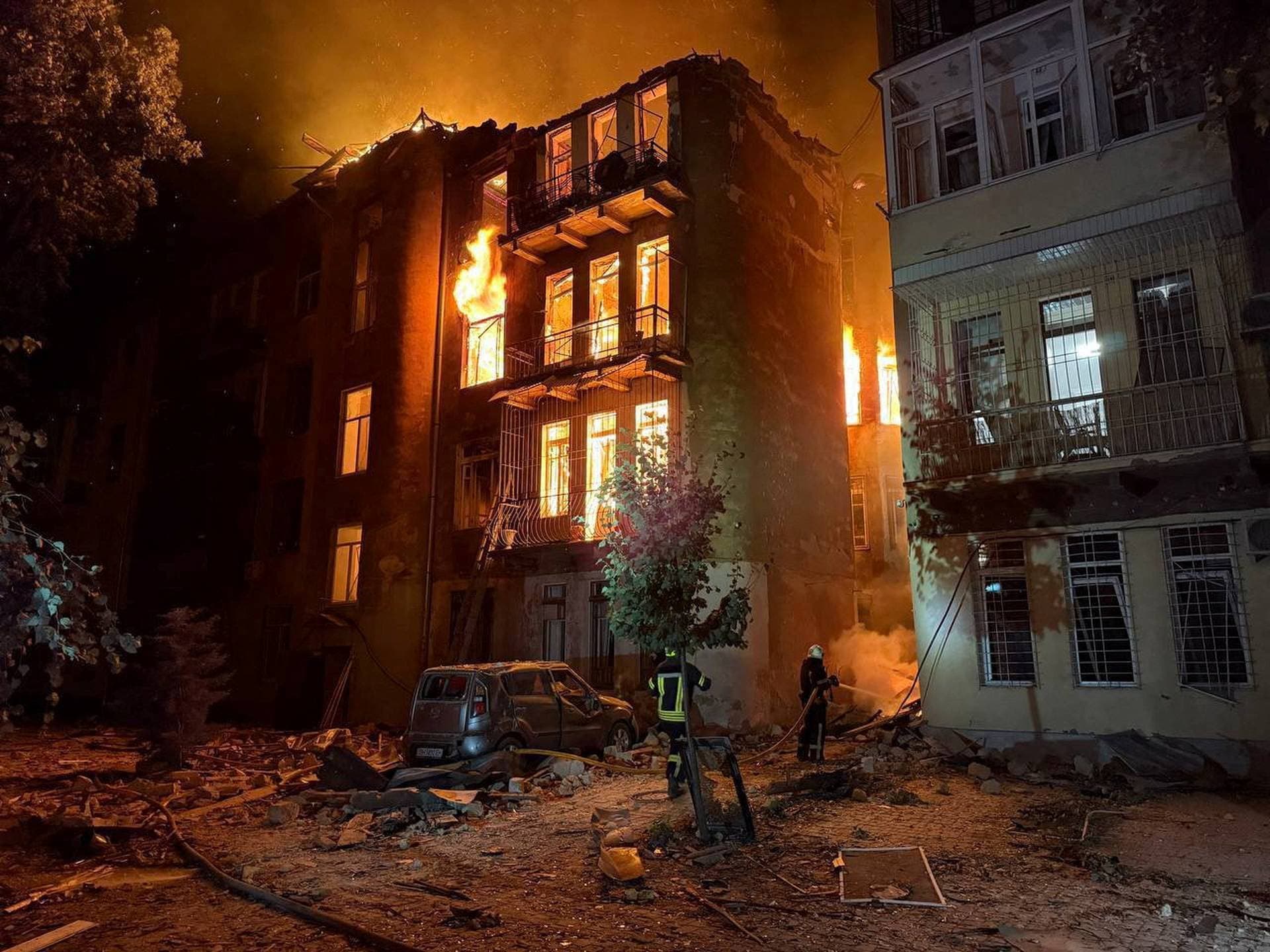 A firefighter works at the site of an apartment building hit by a Russian drone strike in Odesa