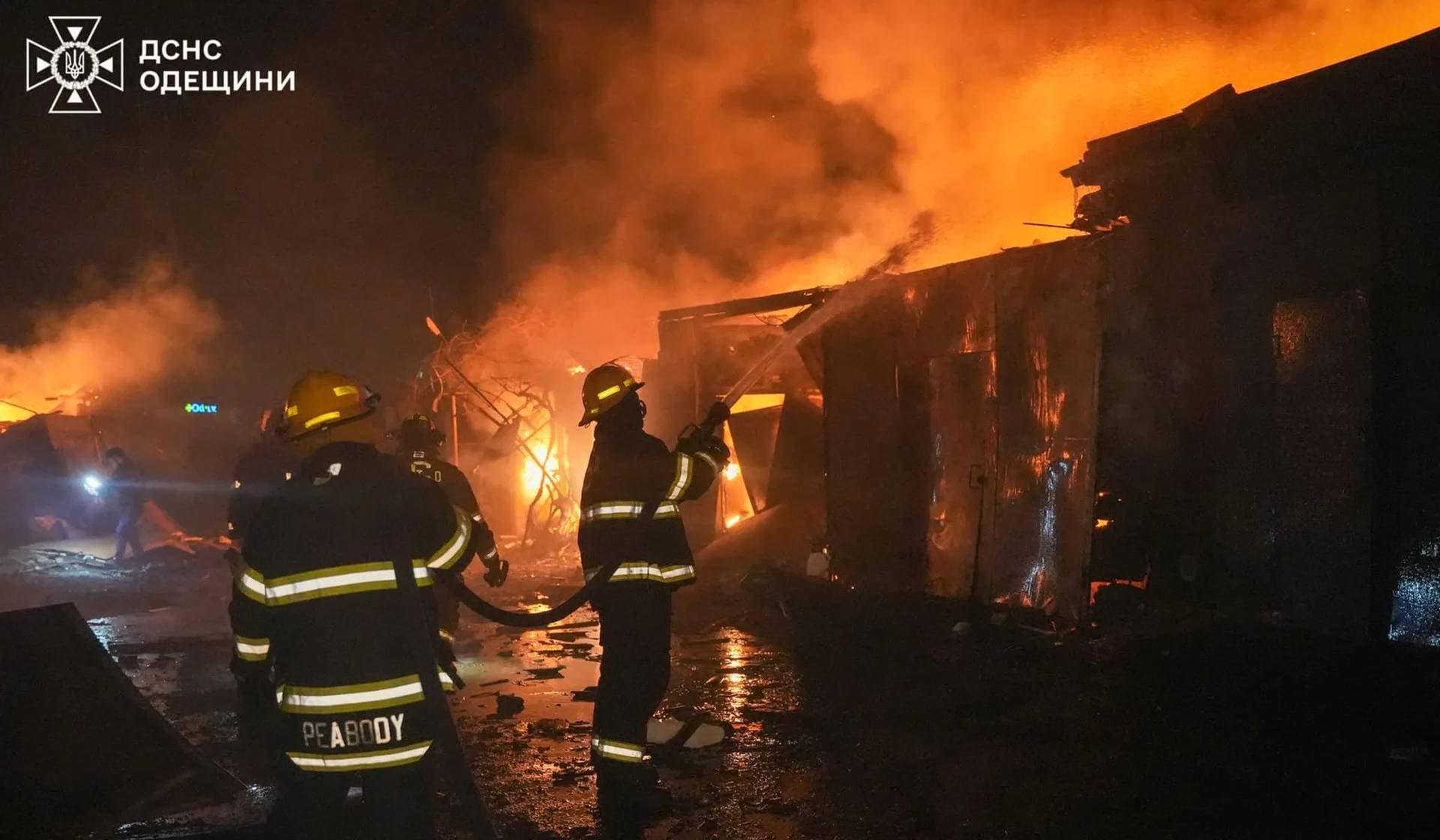 Rescuers work at a site of a Russian drone strike in Odesa