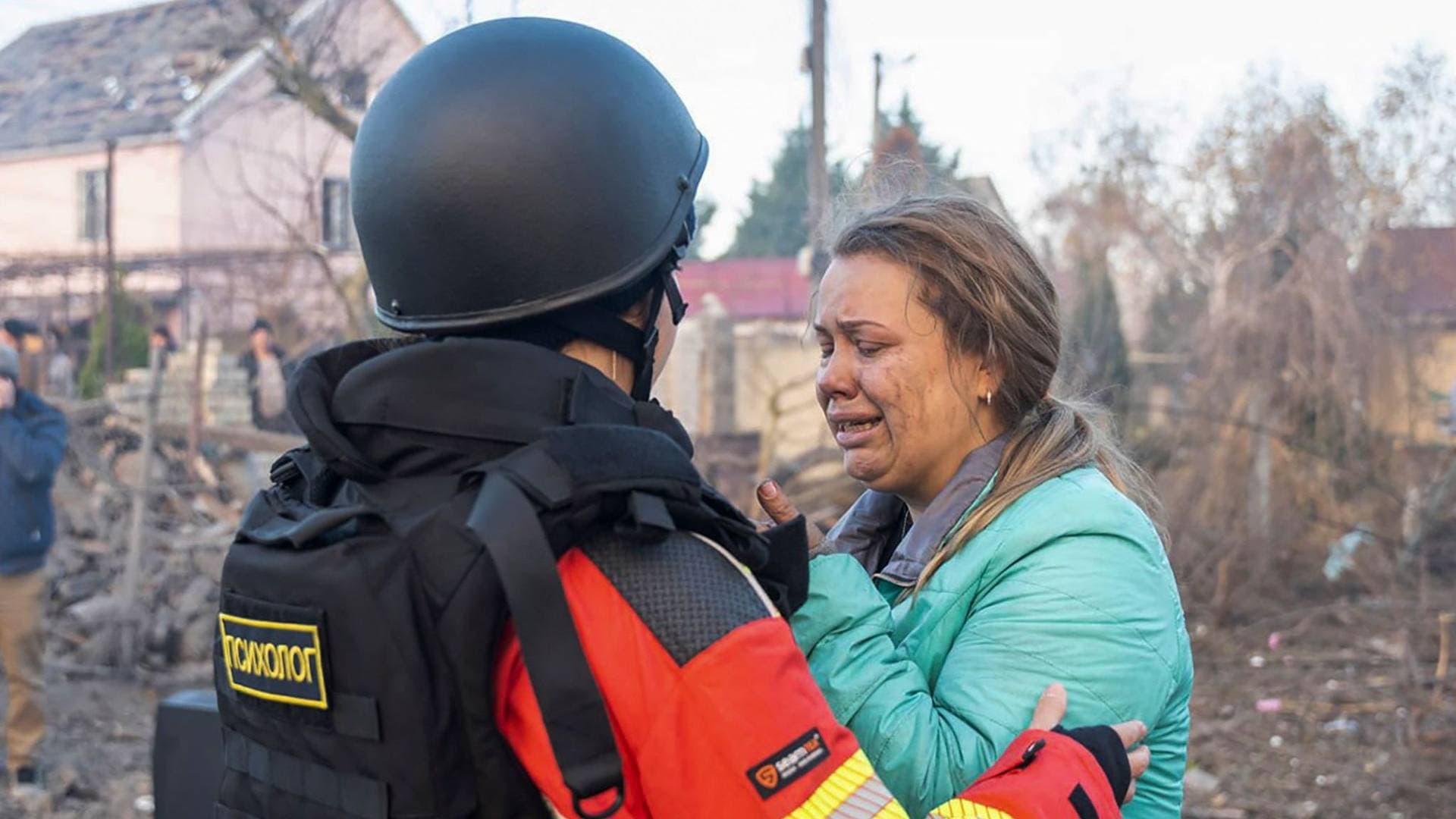 An emergency psychologist supports a resident after a Russian missile strike in Odesa
