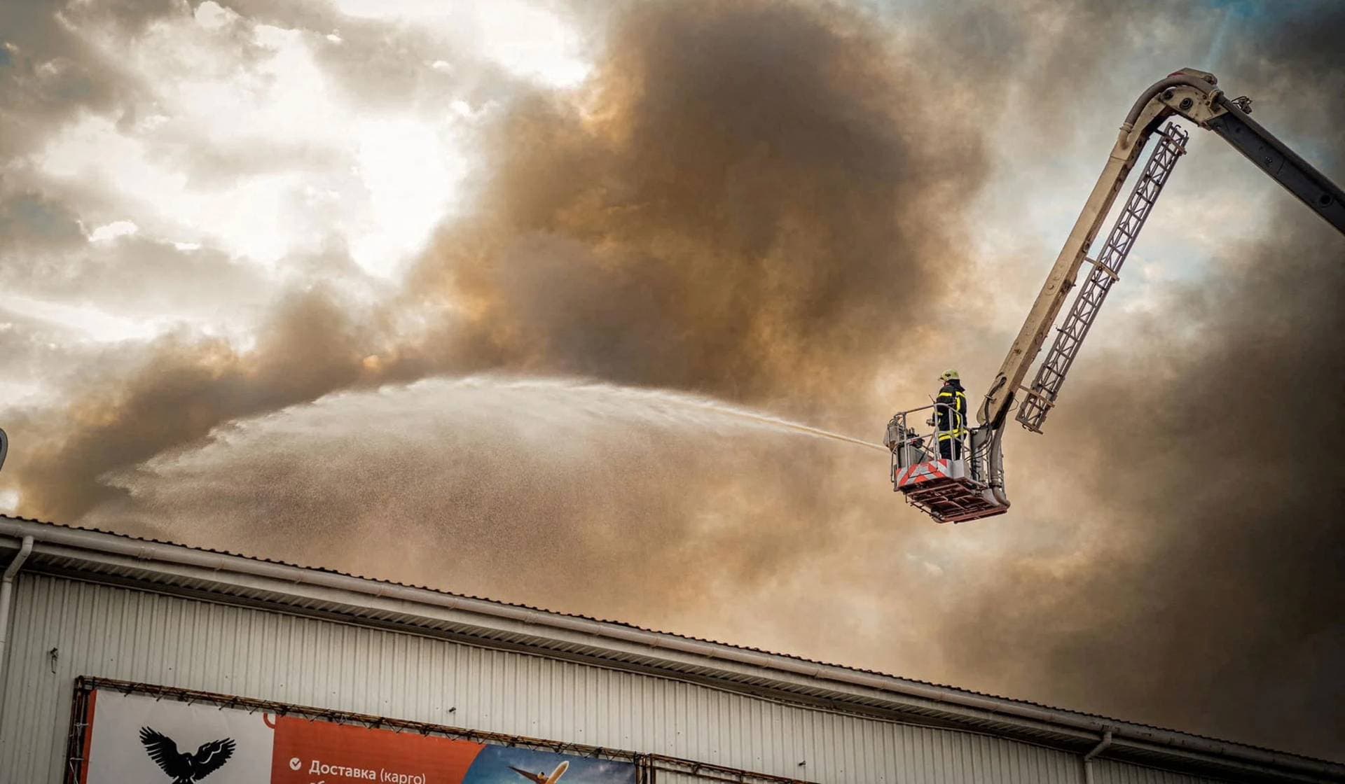 A firefighter works at a site of storage facilities hit during Russian missile and drone strikes in Odesa
