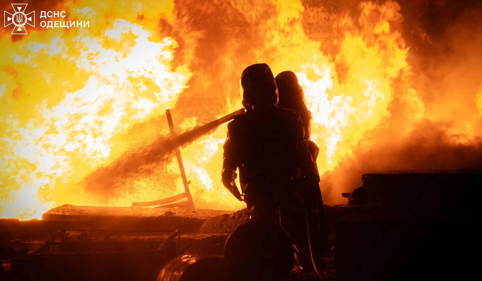 Firefighters work at the site of a Russian drone strike in Odesa