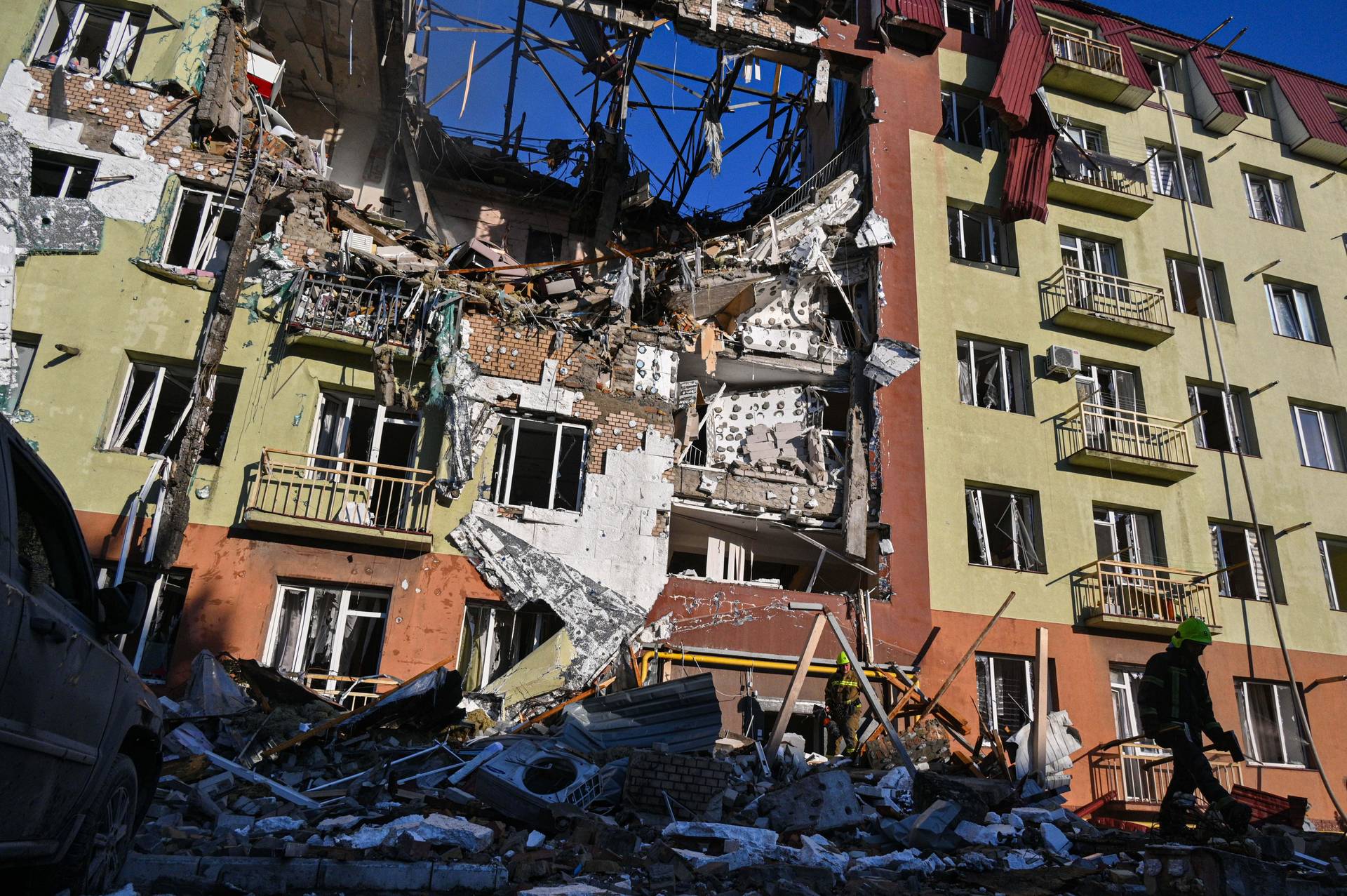 A local man stands in front of residential building which was heavily damaged after a Russian strike in Odesa