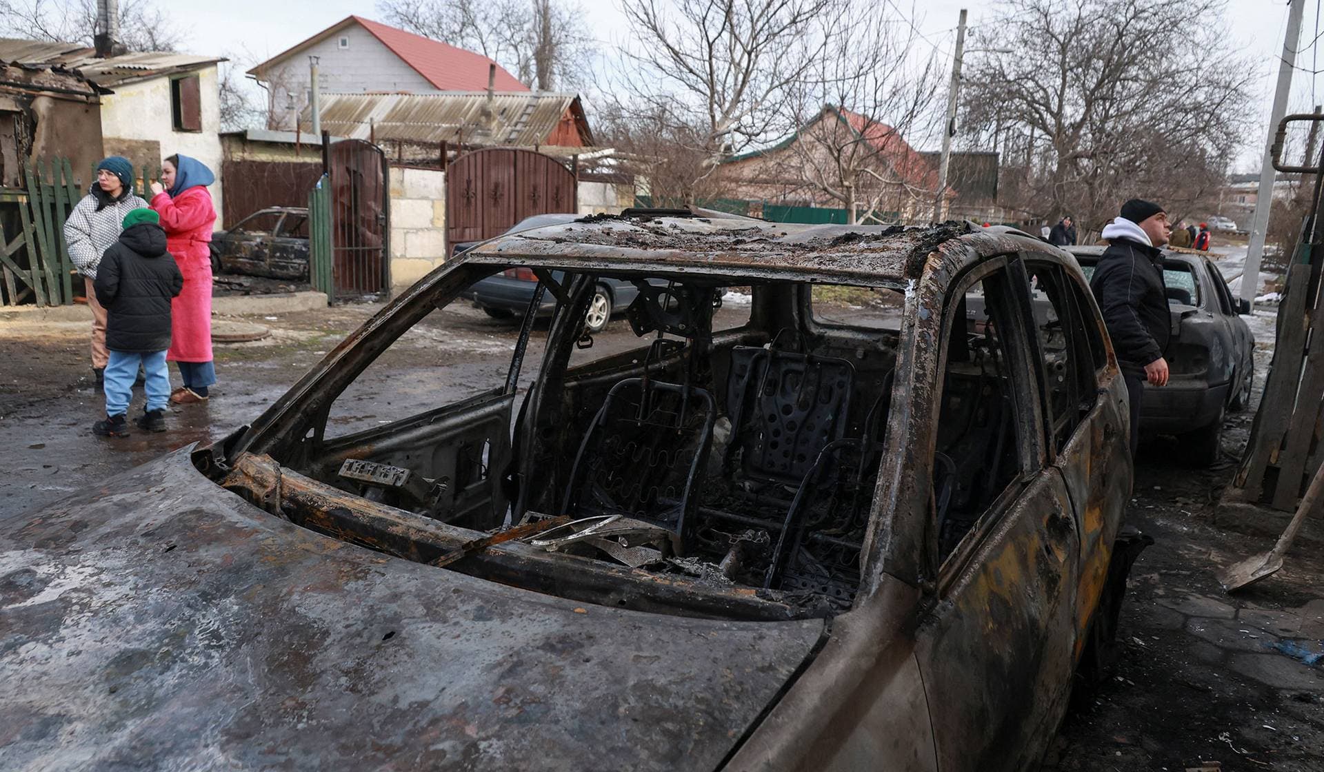 Residents gathered at the site of their neighbours' house hit by a Russian drone strike in Odesa