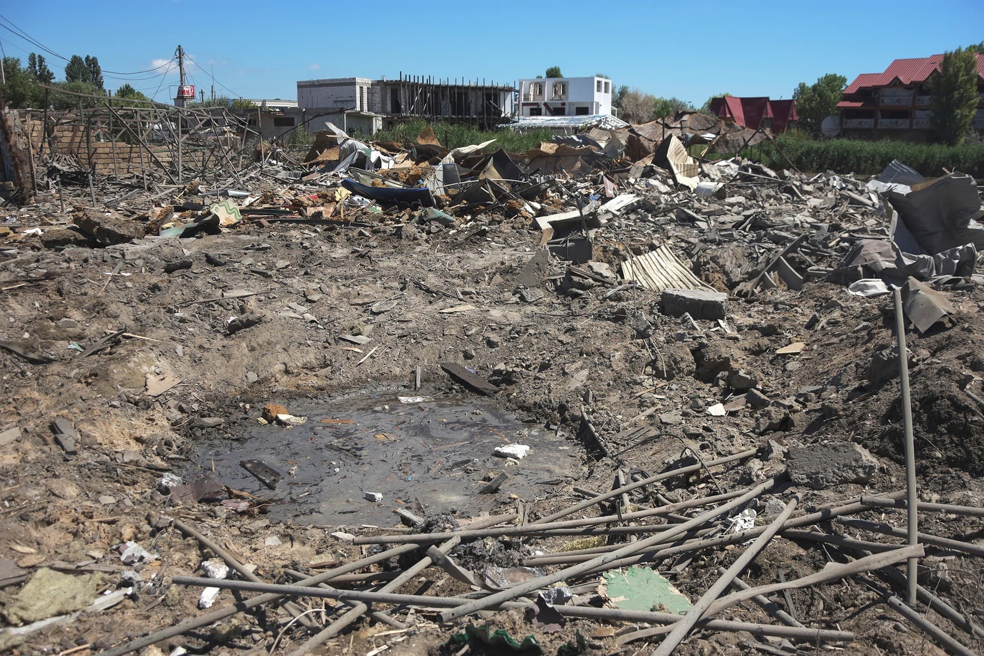 A crater of an explosion is seen in a residence area following Russian shelling on the outskirts of Odesa