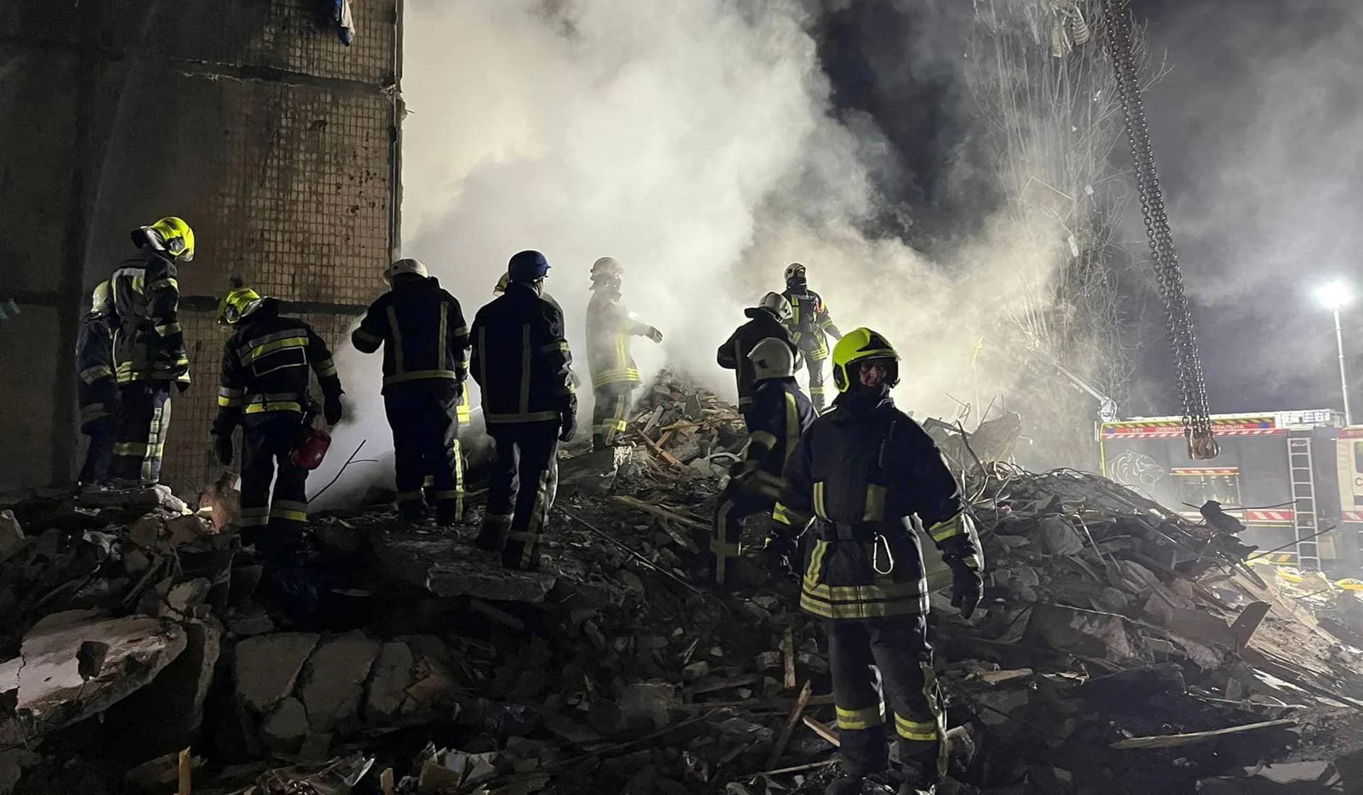 Rescuers work at a site of an apartment building heavily damaged by a Russian drone strike in Odesa