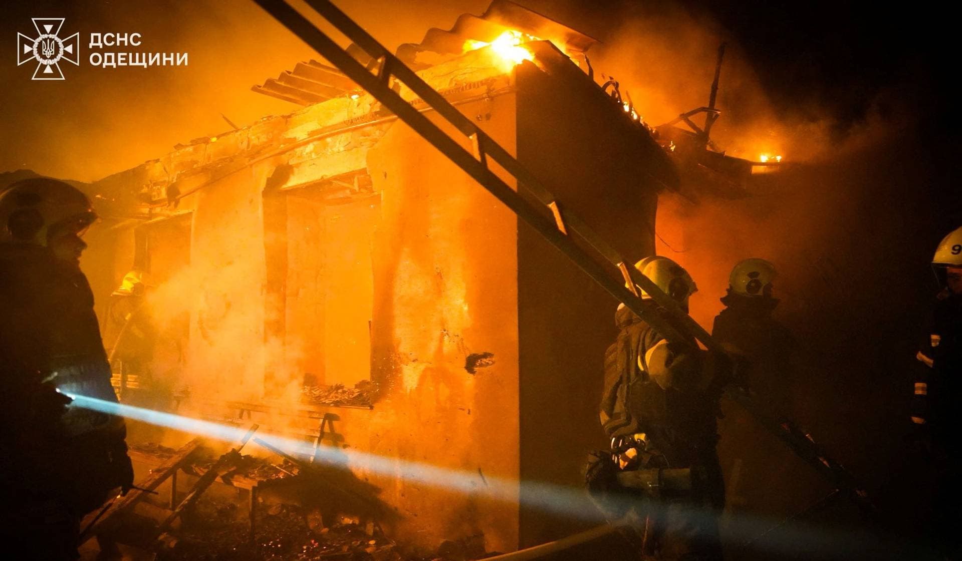 Firefighters work at the site of a residential area hit by Russian drone strikes in Odesa