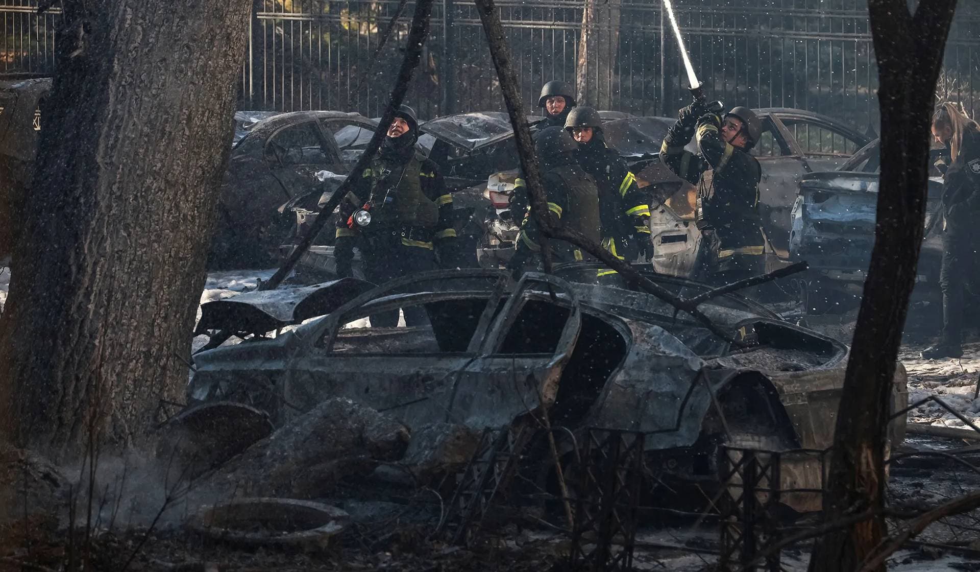 Rescuers work at a site of an apartment building hit by a Russian missile strike in Odesa