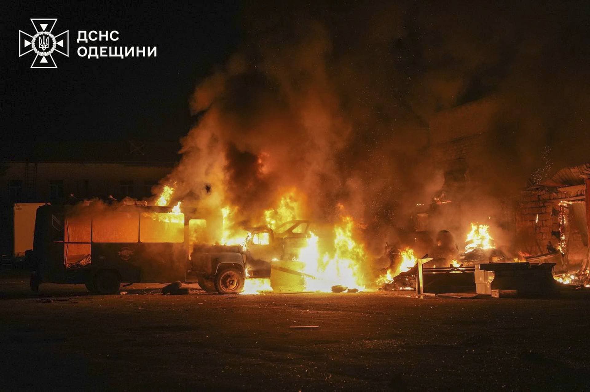 Vehicles burn at the site of a private enterprise hit by a Russian drone strike in Odesa