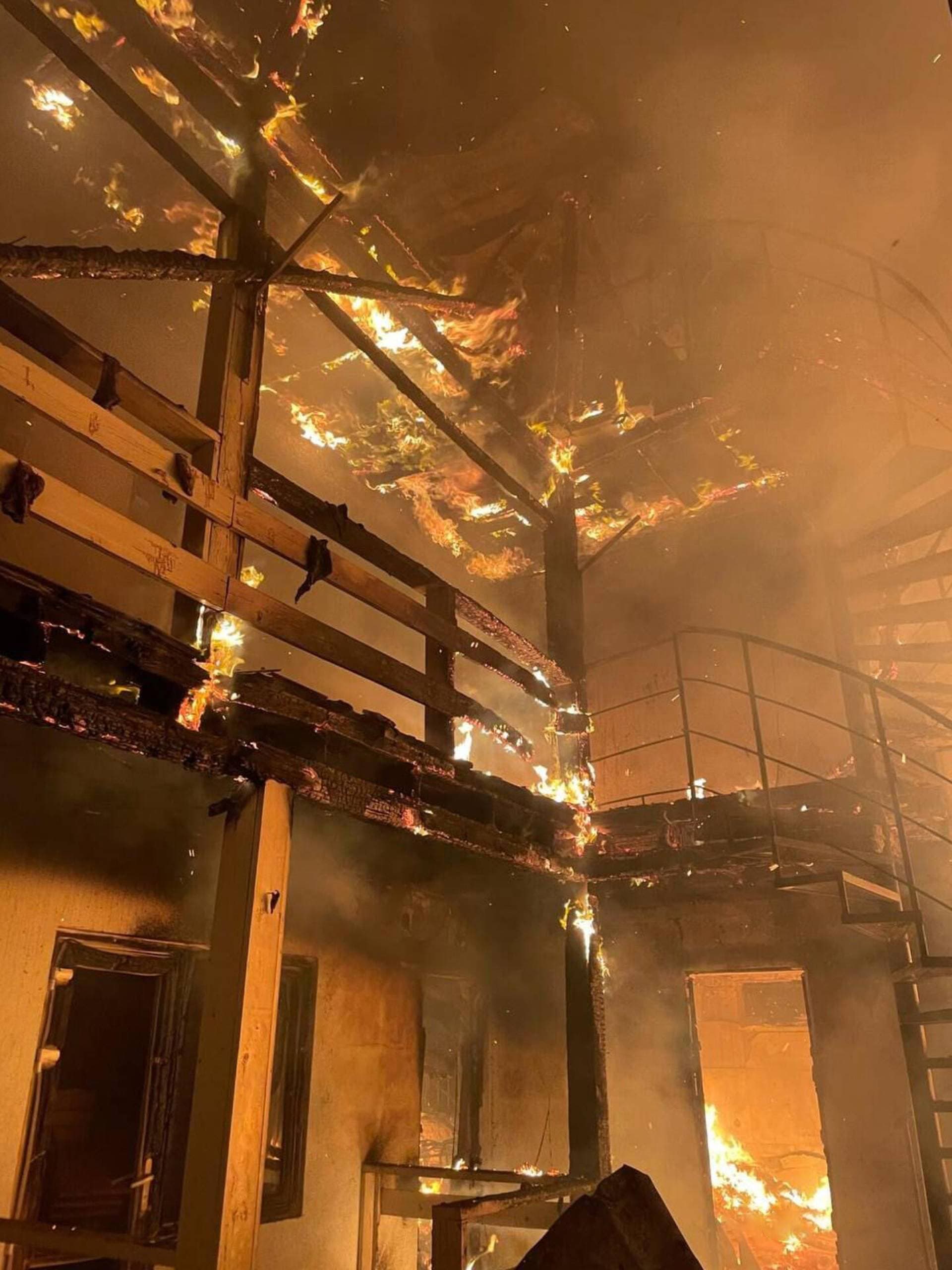 burning storage facilities heavily damaged by a Russian missile strike in Odesa region