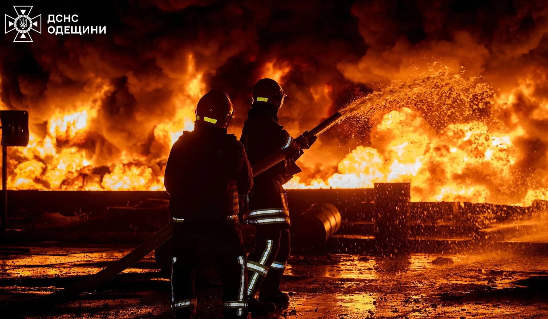 Firefighters work at the site of a Russian drone strike in Odesa