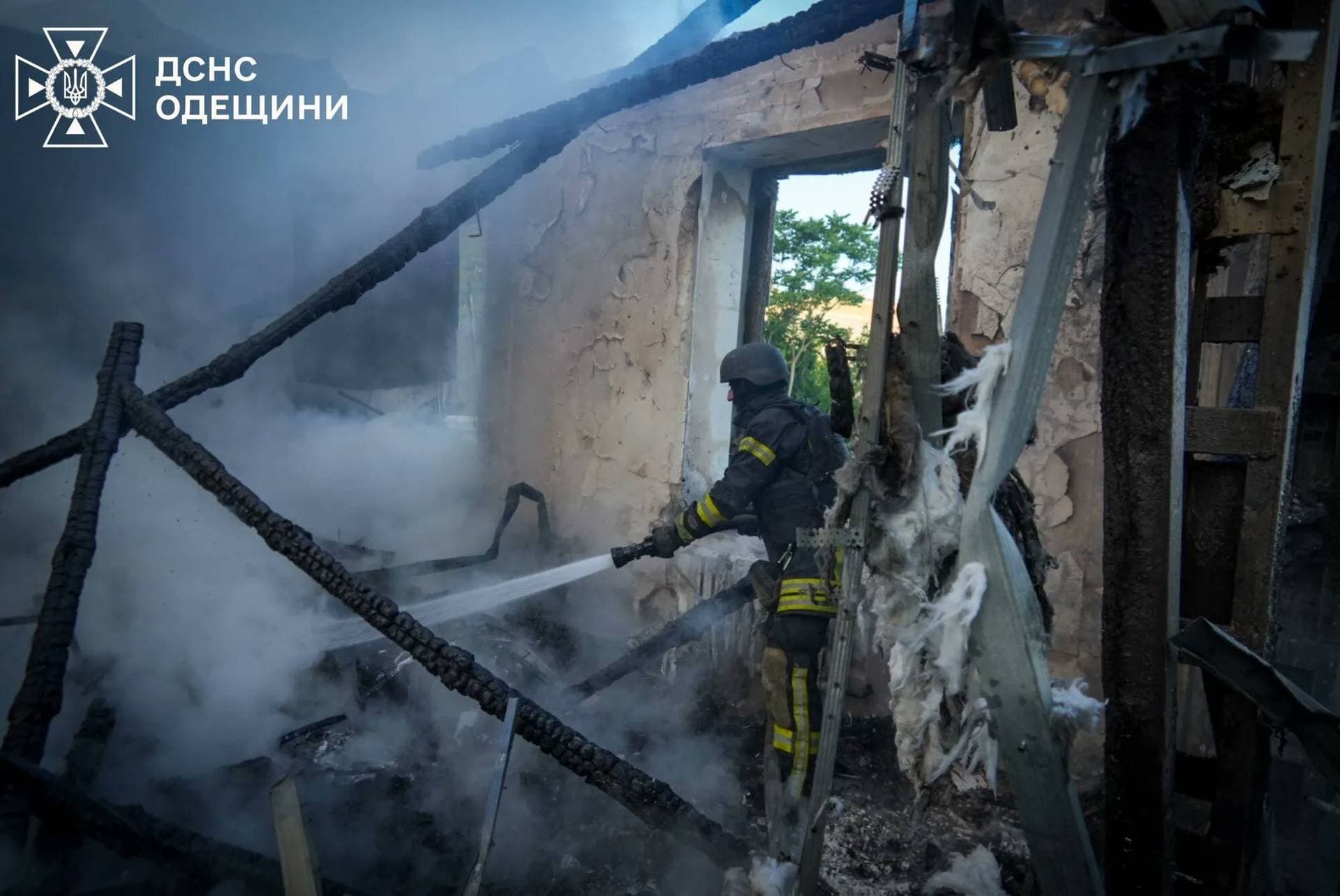 Residents leave the site of a Russian drone strike in Odesa