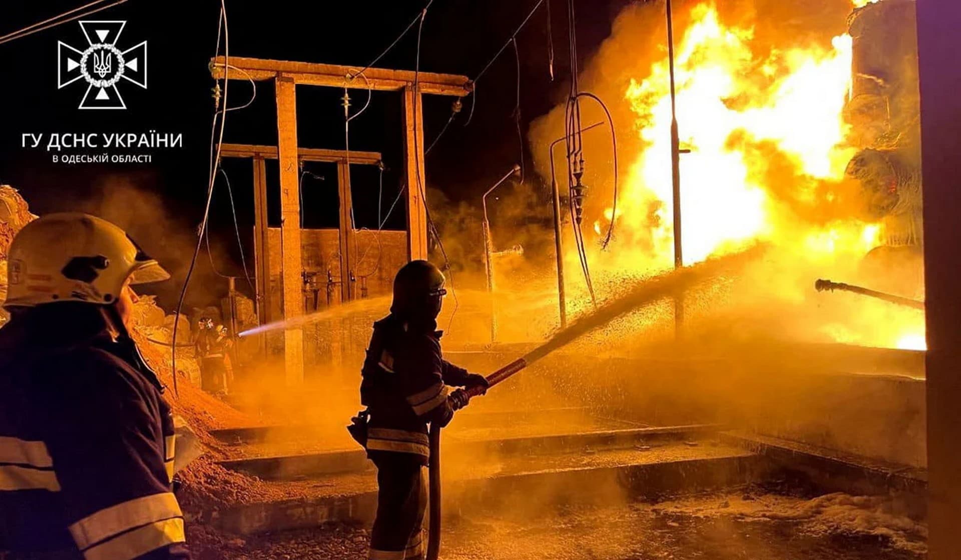 Firefighters work at a site of a critical power infrastructure object hit during Russian missile attacks in the Odesa Region