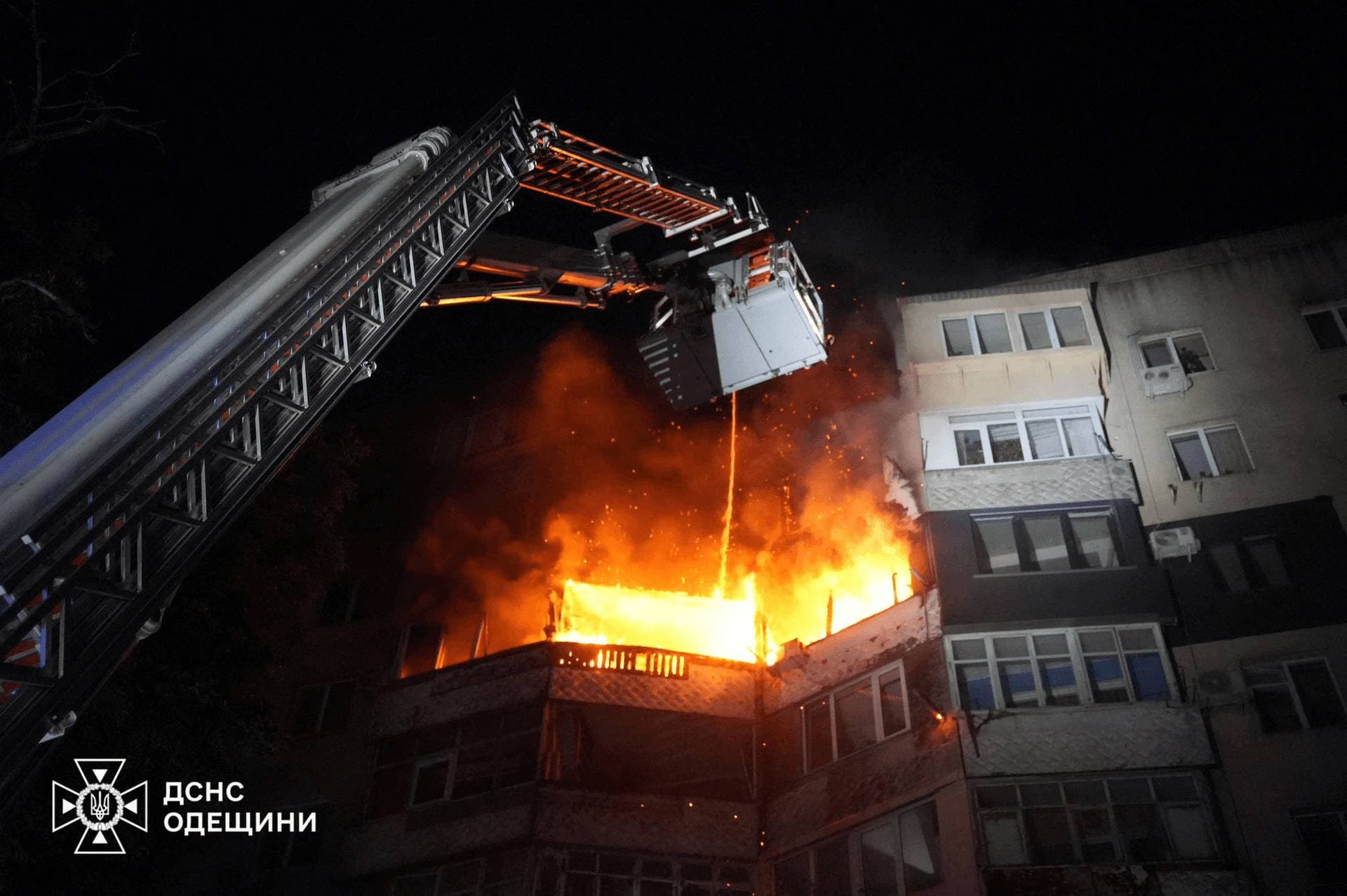 A firefighter works at the site of an apartment building hit by Russian drone strike in Odesa