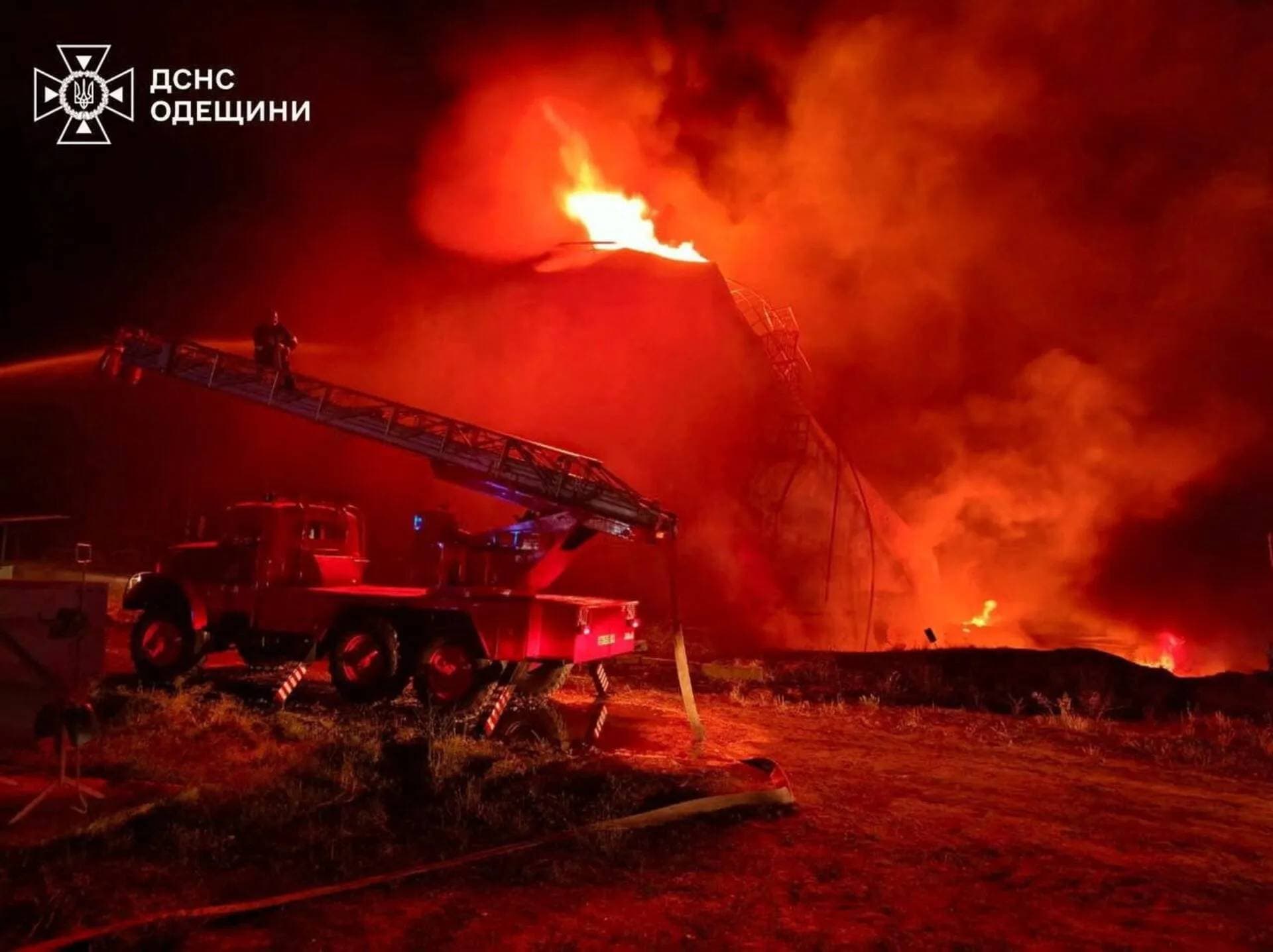 A firefighter works at the site of a fuel storage facility hit by a Russian drone strike in Odesa Region