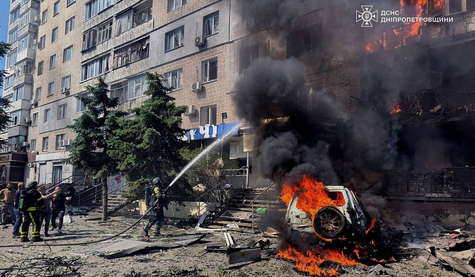 Rescuers work at a site of an apartment building hit by a Russian drone strike in Pavlohrad, Dnipropetrovsk Region