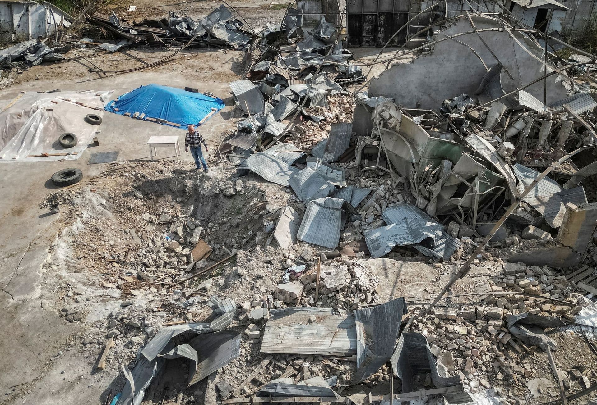 Ukrainian farmer near the destroyed granary