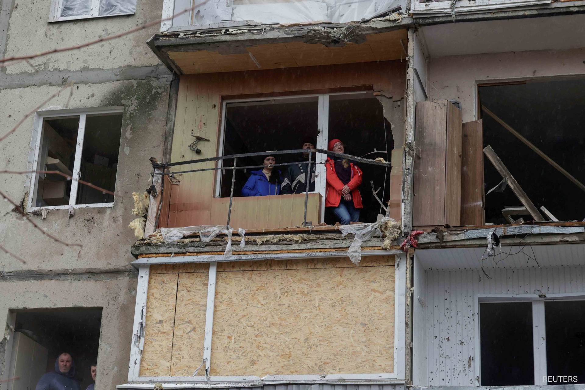Rescuers work at the site of an apartment building hit by a Russian missile strike in Poltava